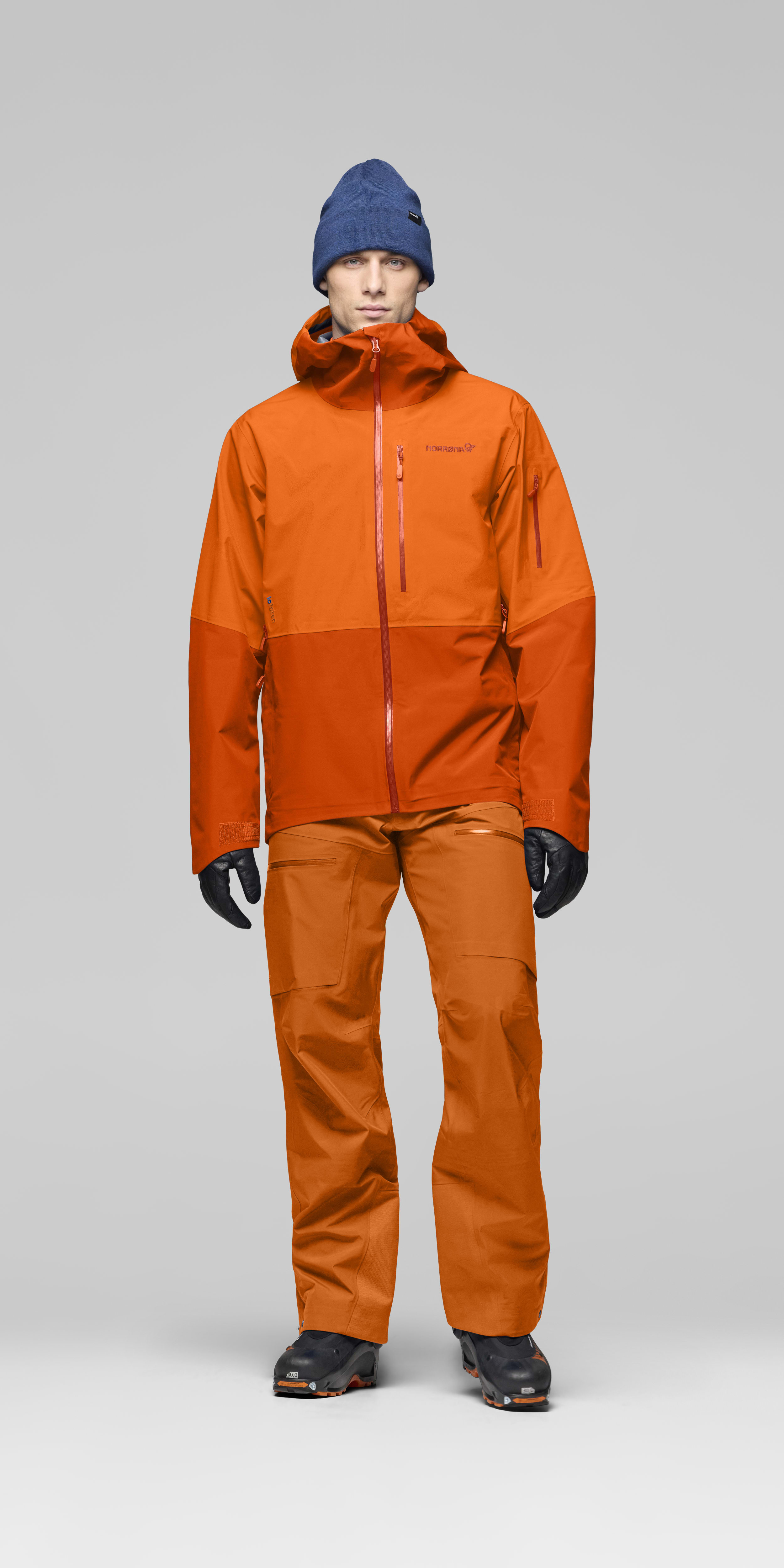 Male Look opening image of lofoten Gore-Tex Pants Gold Flame