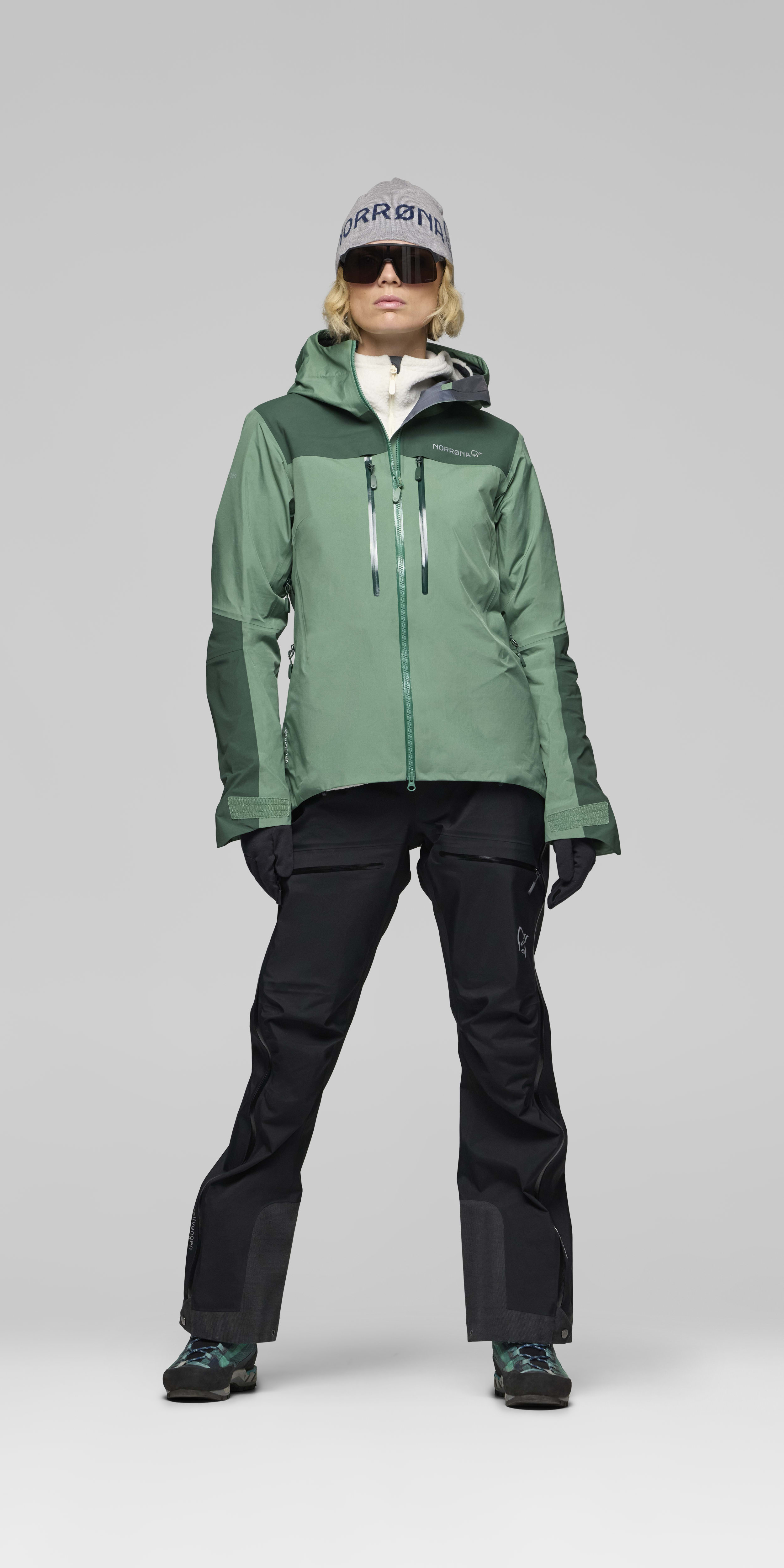 Female Look opening image of trollveggen Gore-Tex Pro light Jacket Dark Ivy
