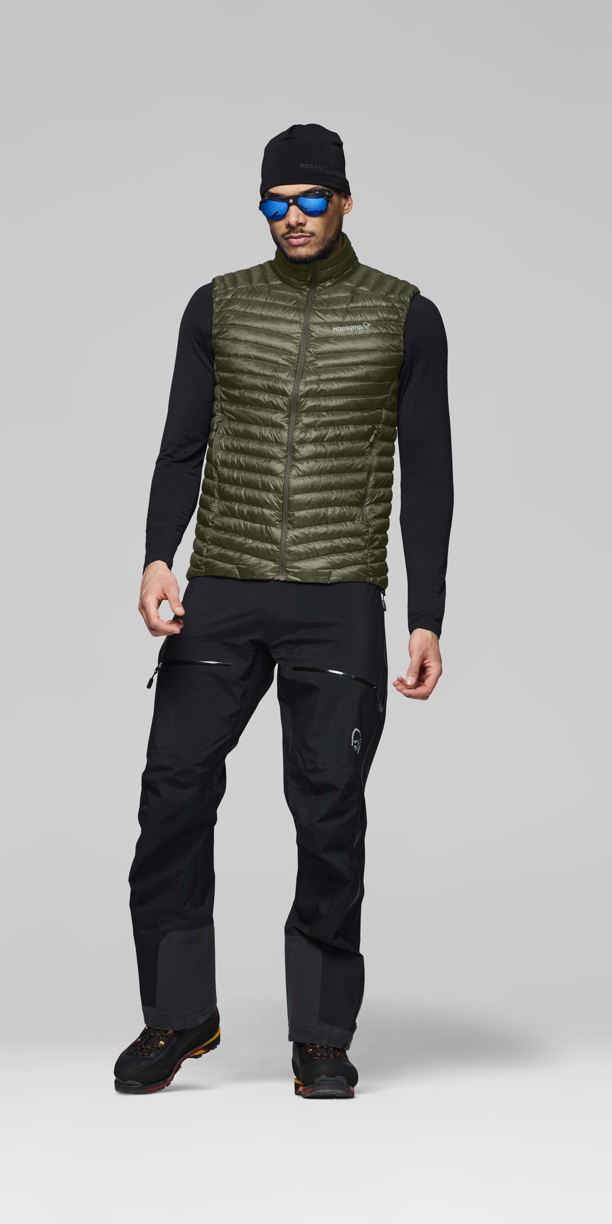 Male Look front image of trollveggen down800 super light Vest Deep Lichen Green