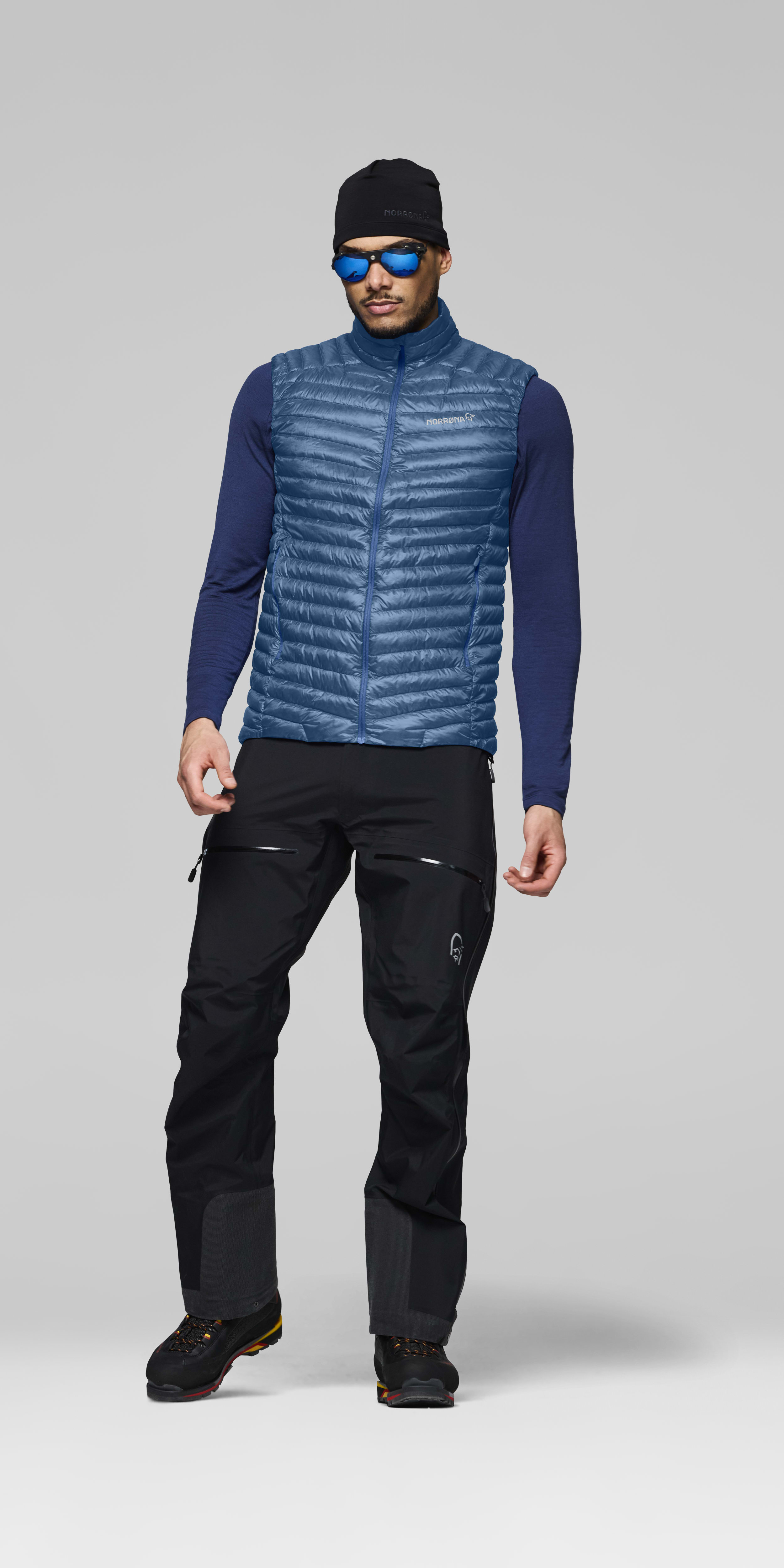 Male Look front image of trollveggen down800 super light Vest Dark Blue