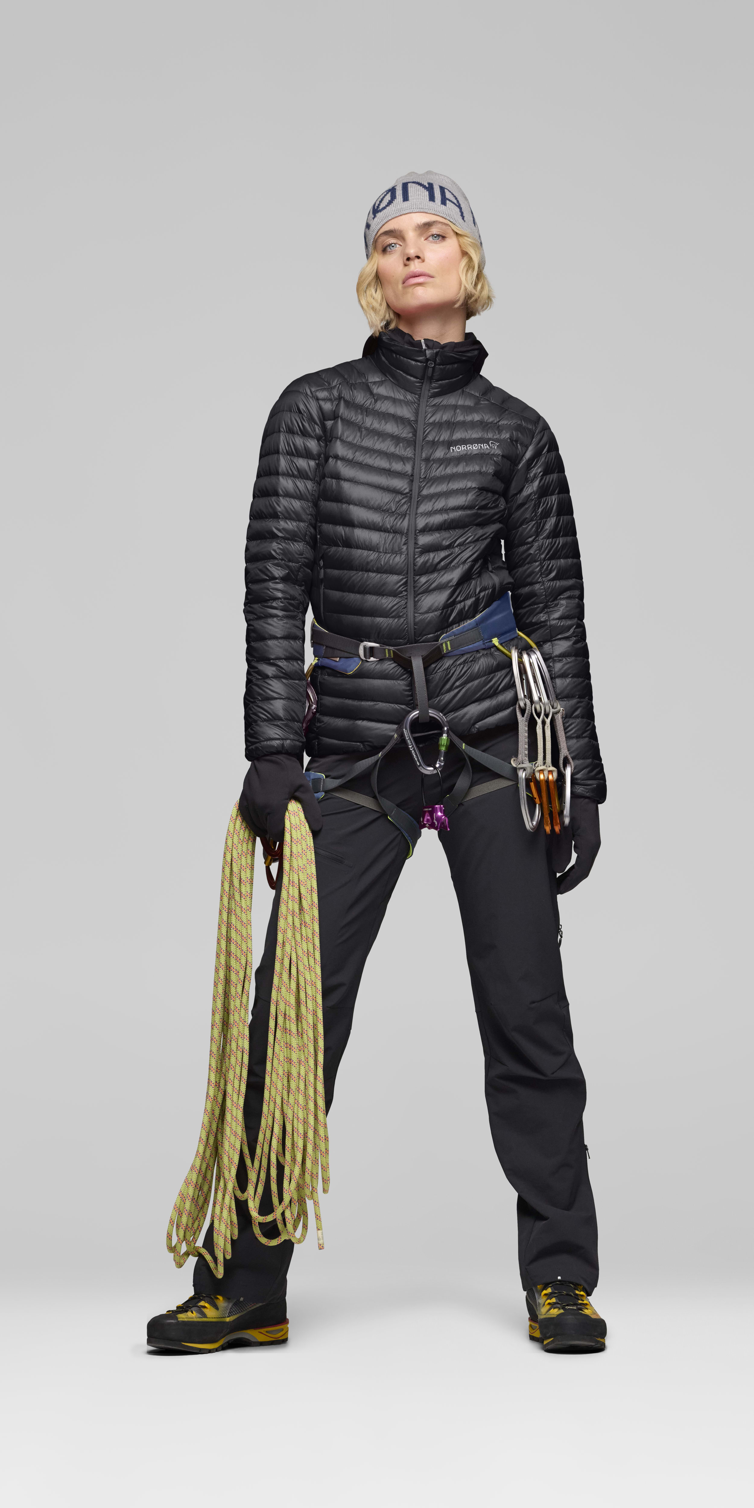 Female Look opening image of trollveggen down800 super light Jacket Caviar Black