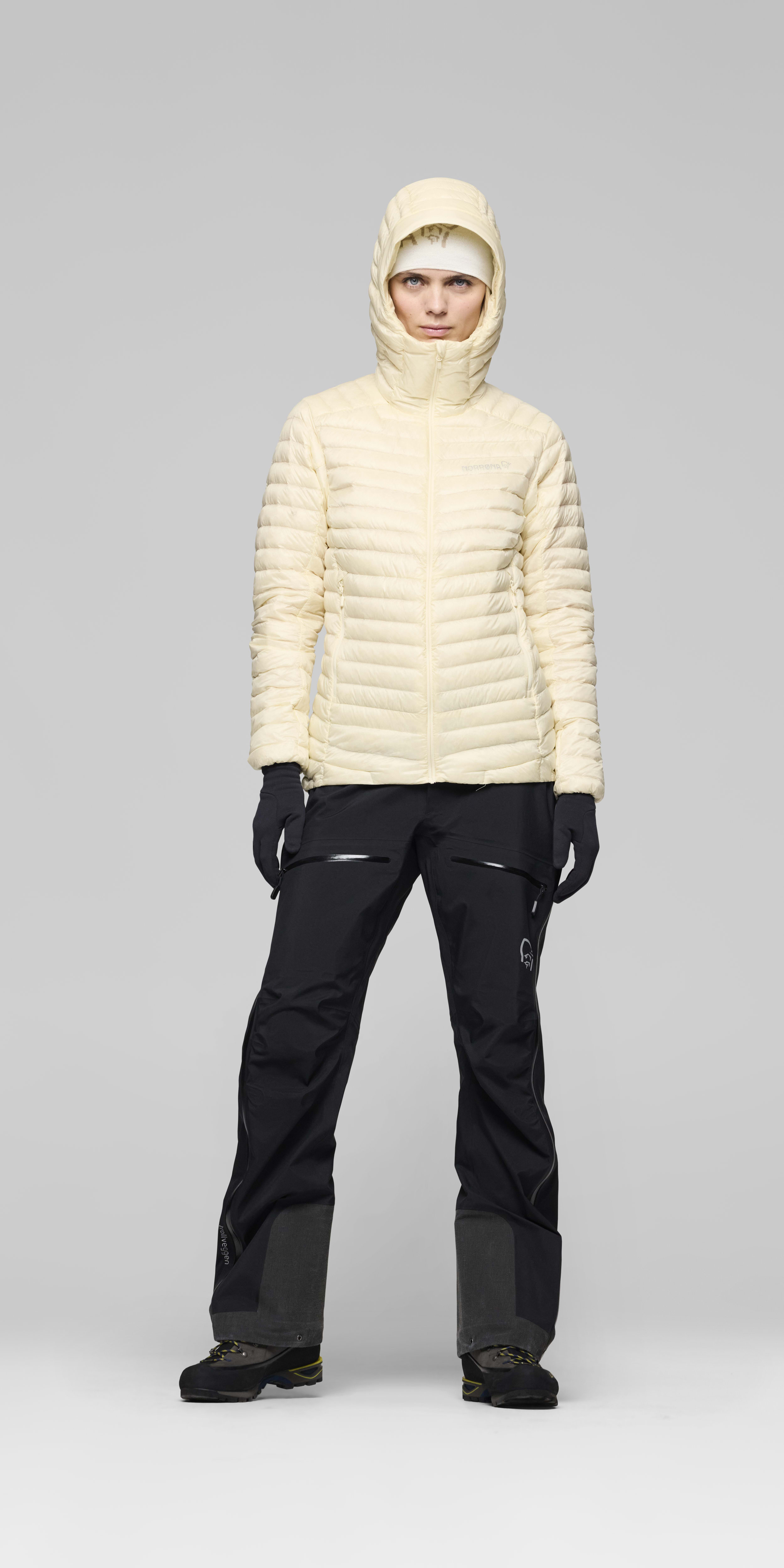 Female Look front image of trollveggen down800 super light Hood Whisper White