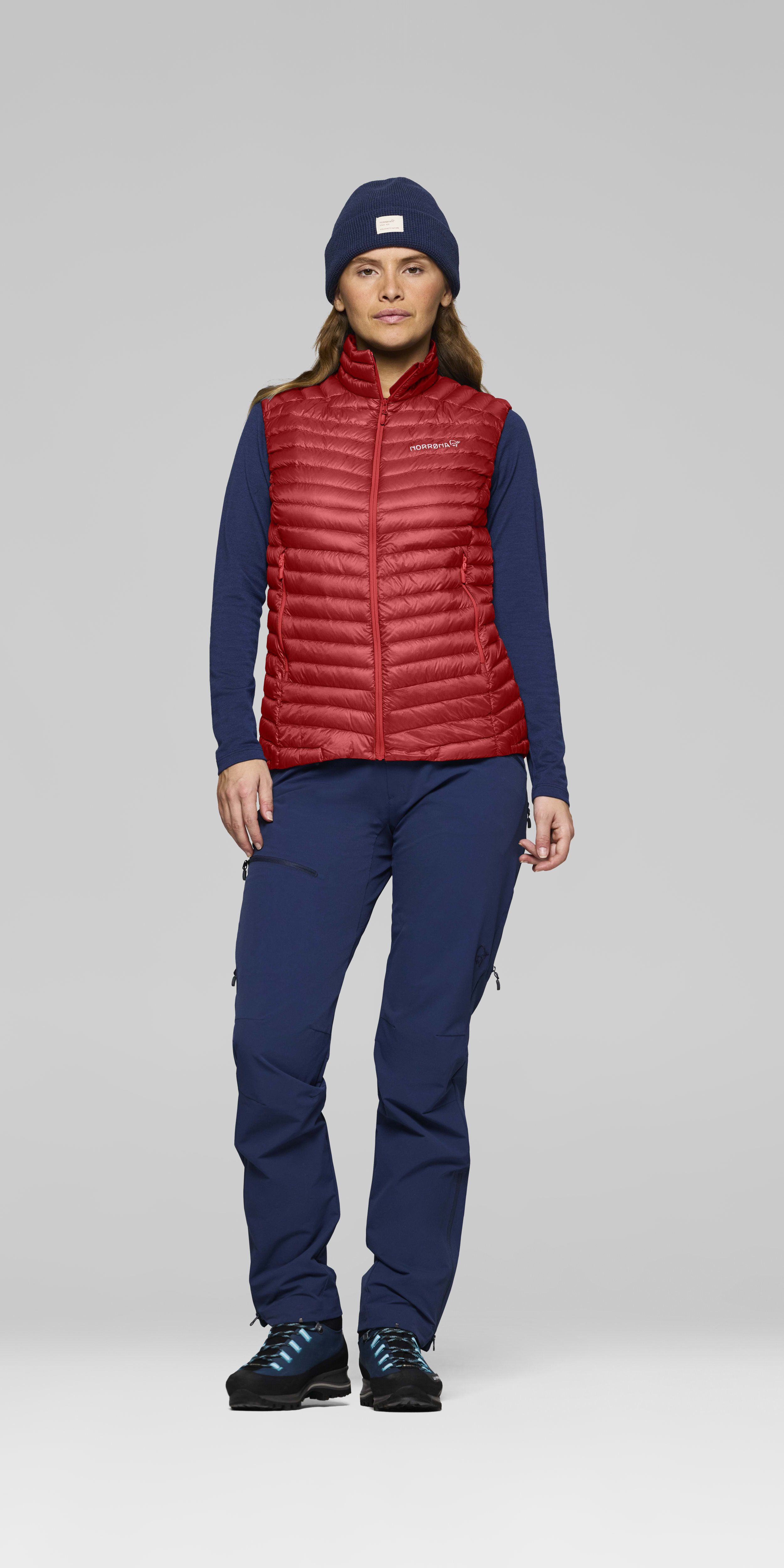 Female Look front image of trollveggen down800 super light Vest Baked Apple