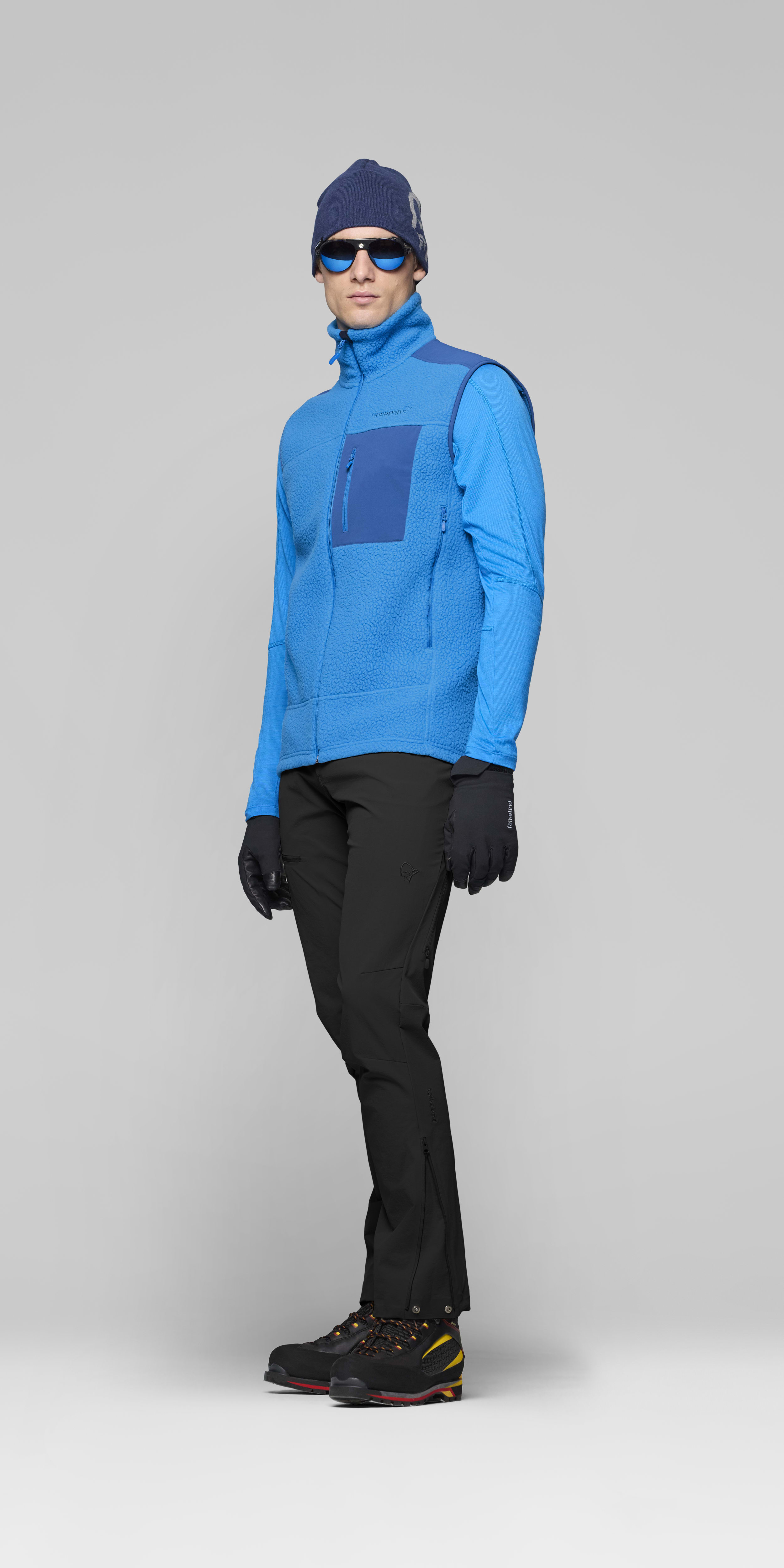 Male Look side image of trollveggen warm3 Vest Brilliant Blue/Dark Blue
