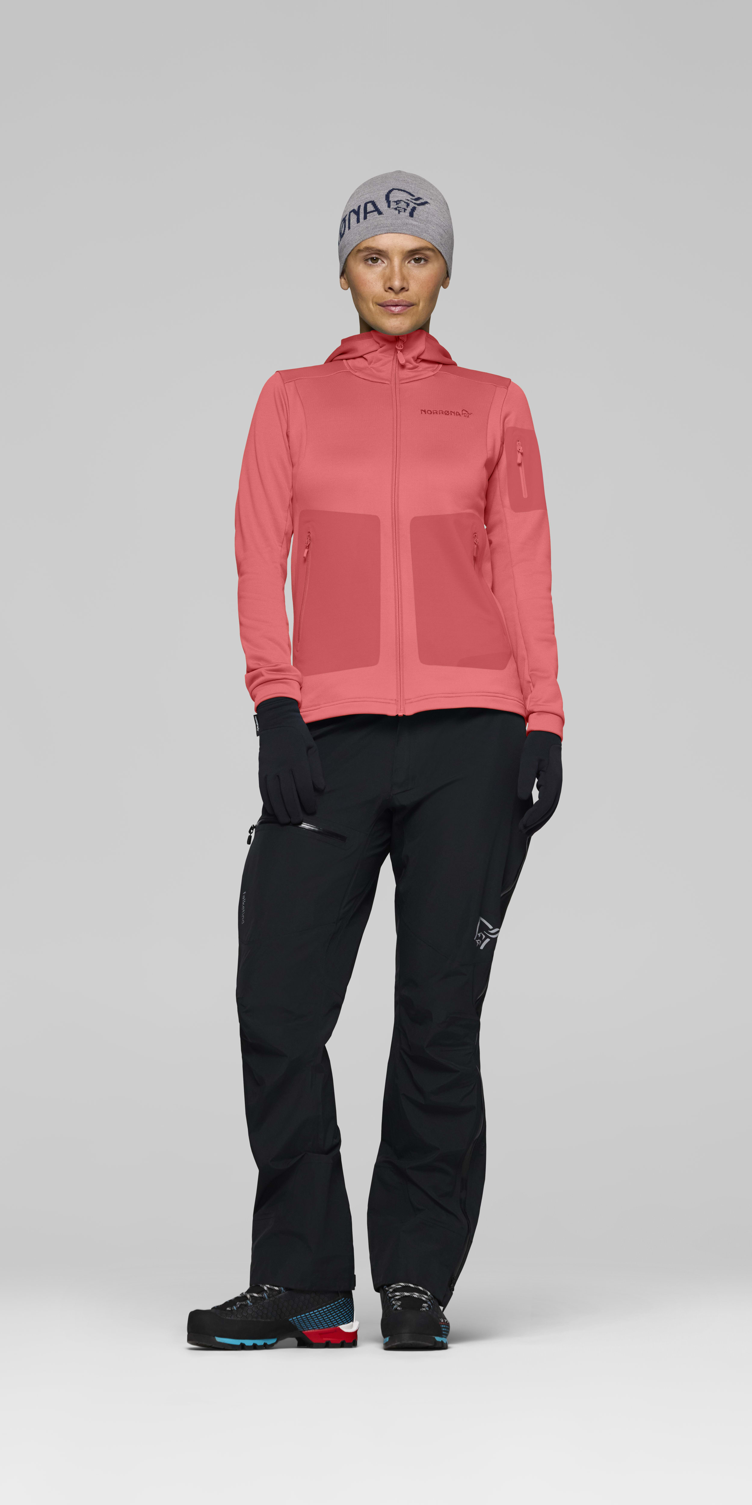 Female Look front image of falketind warm2 stretch Hood Deep Sea Coral/Baked Apple