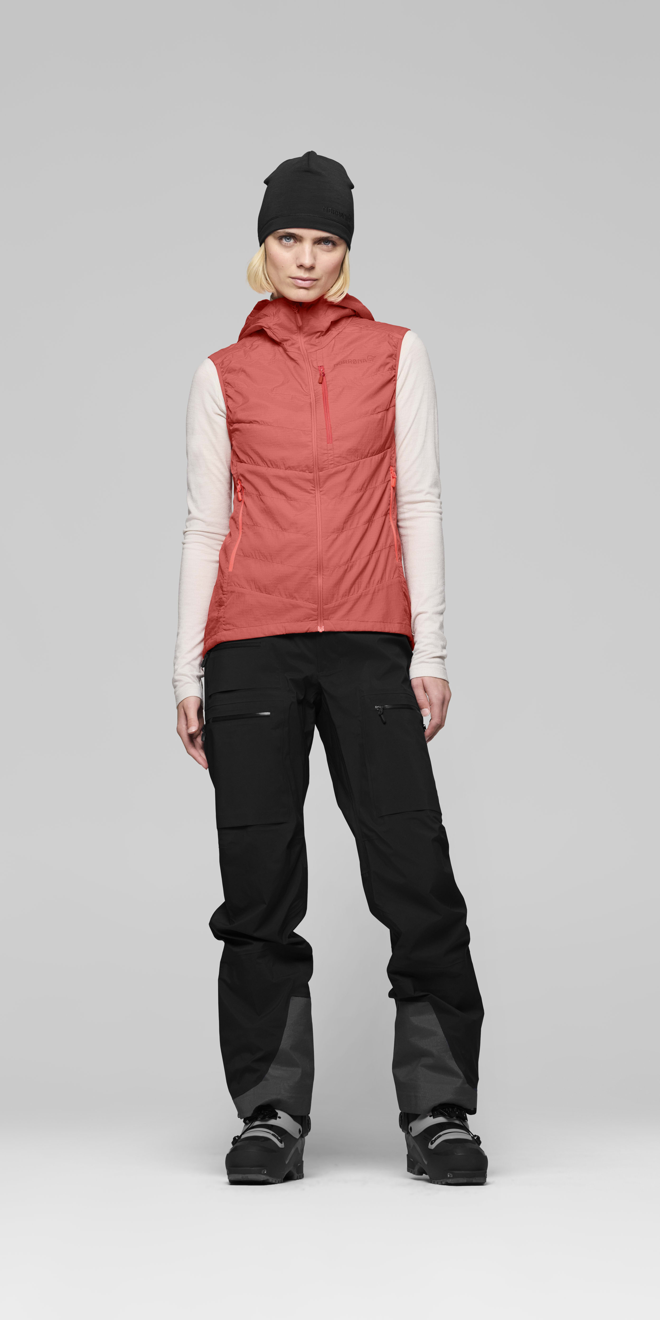 Female Look front image of lyngen thermo100active Vest Deep Sea Coral