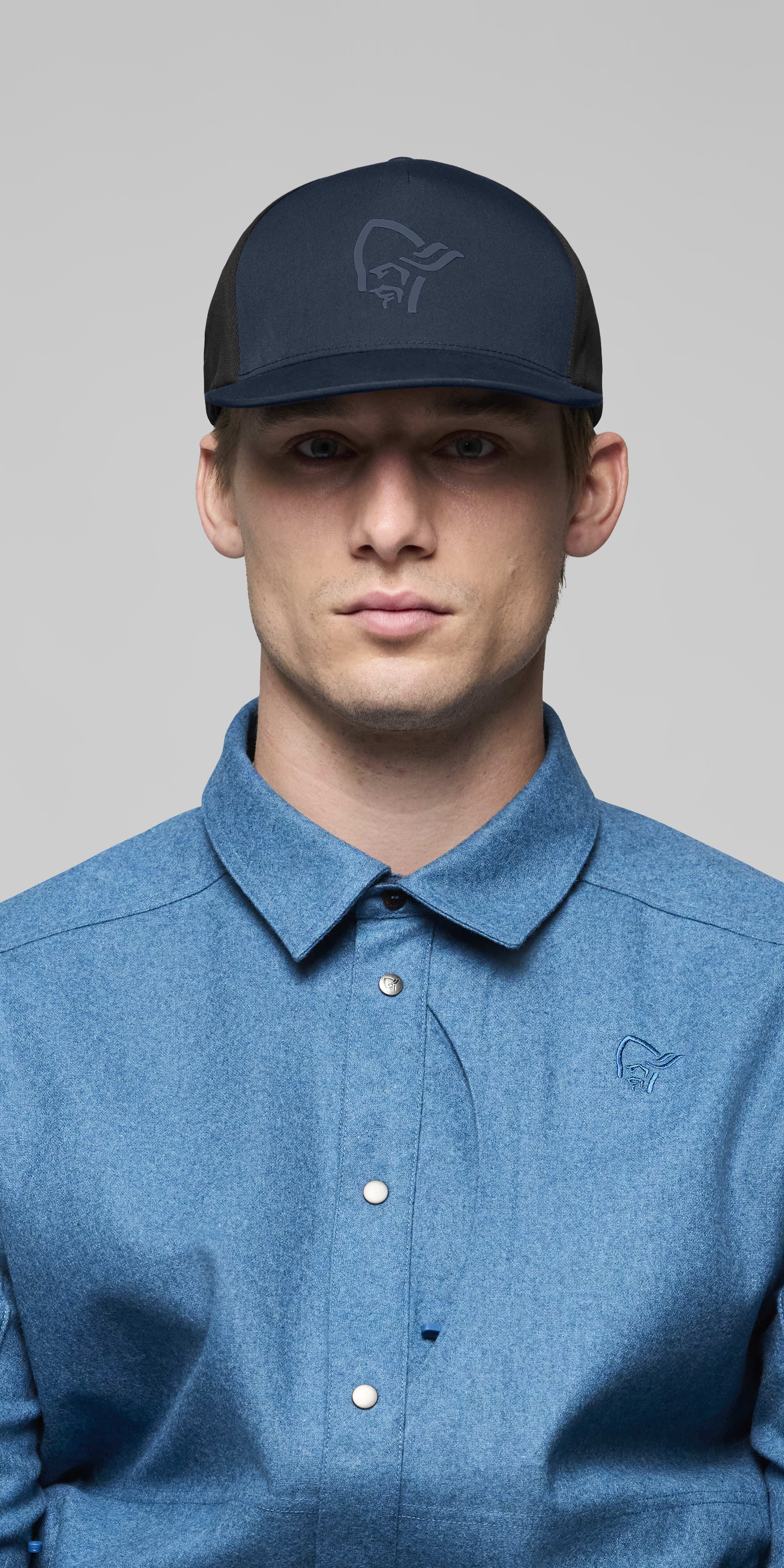 Female Look front image of 29 tech trucker Cap Indigo Night