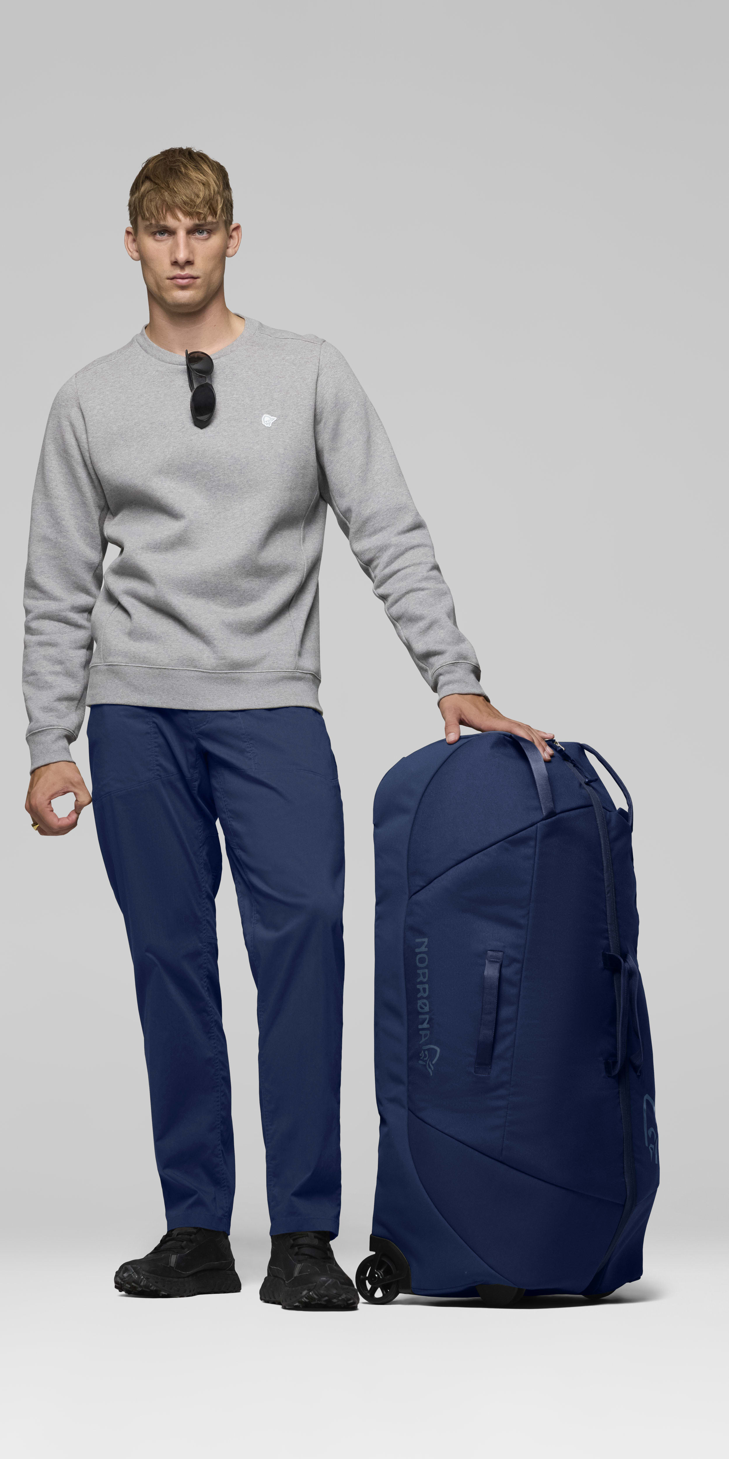 Female Look front image of norrona dividable 125L Trolley Bag Indigo Night