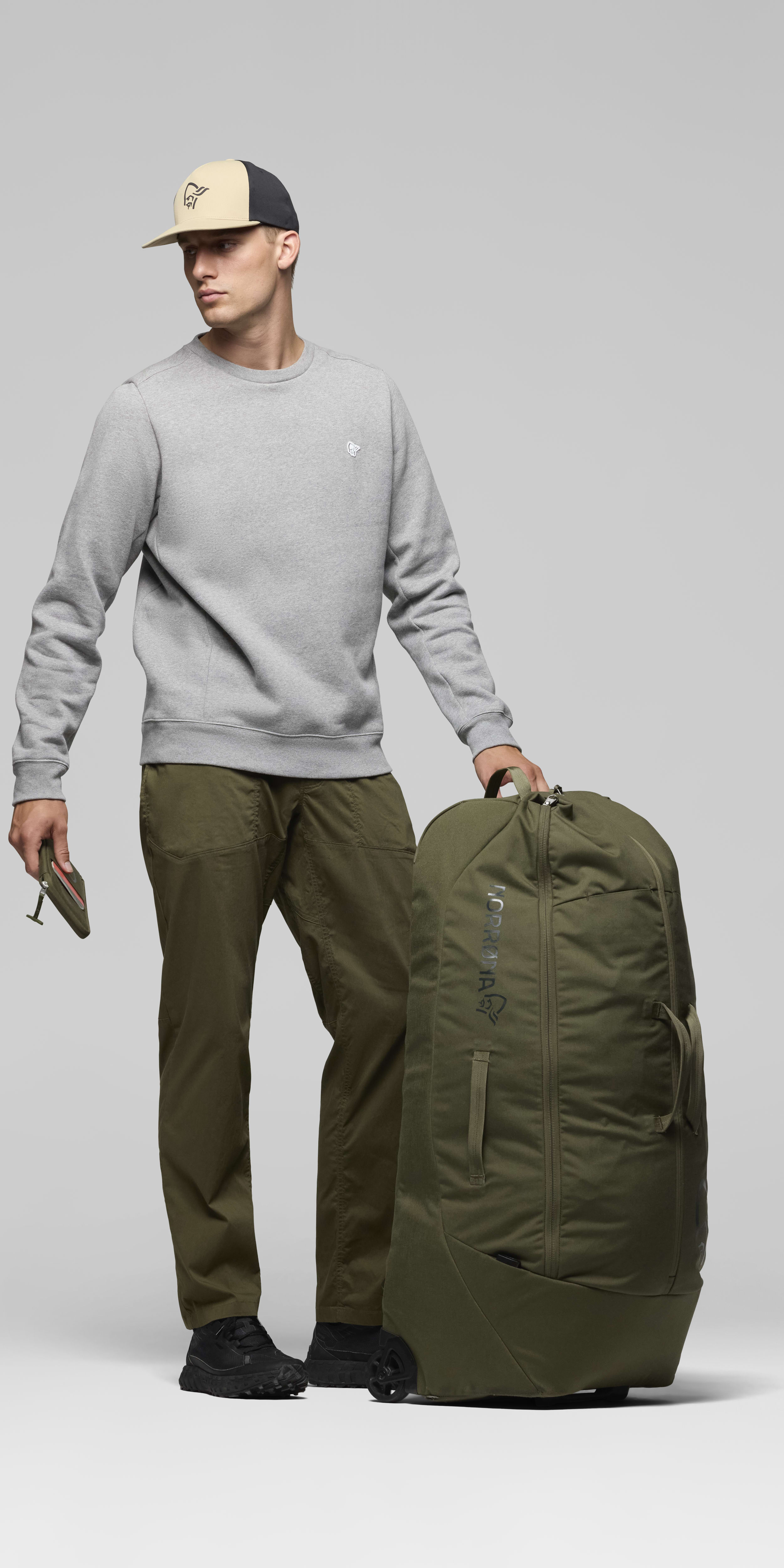 Female Look opening image of norrona 120L Trolley Bag Olive Night