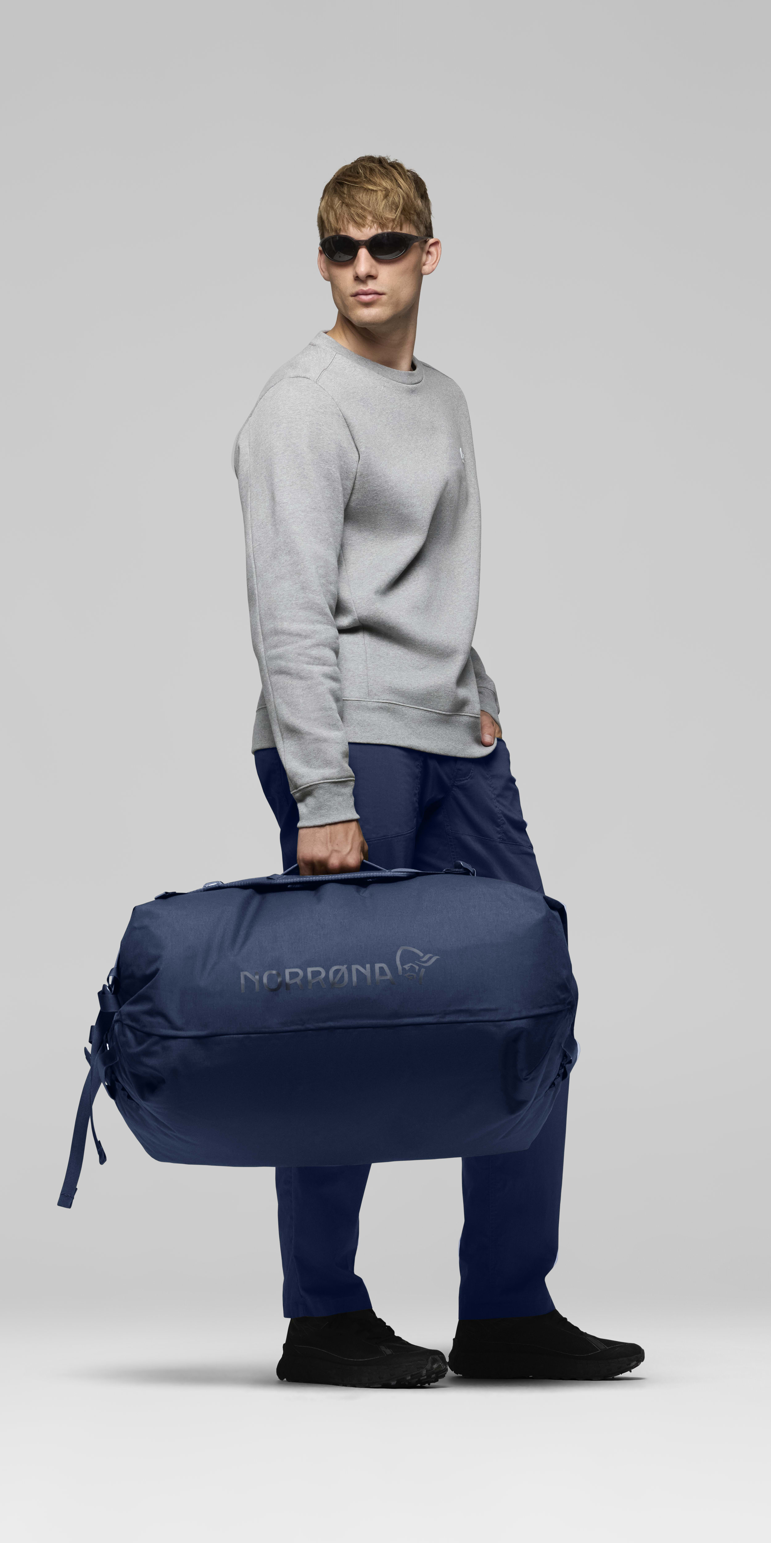 Female Look front image of norrona 90L Duffel Bag Indigo Night