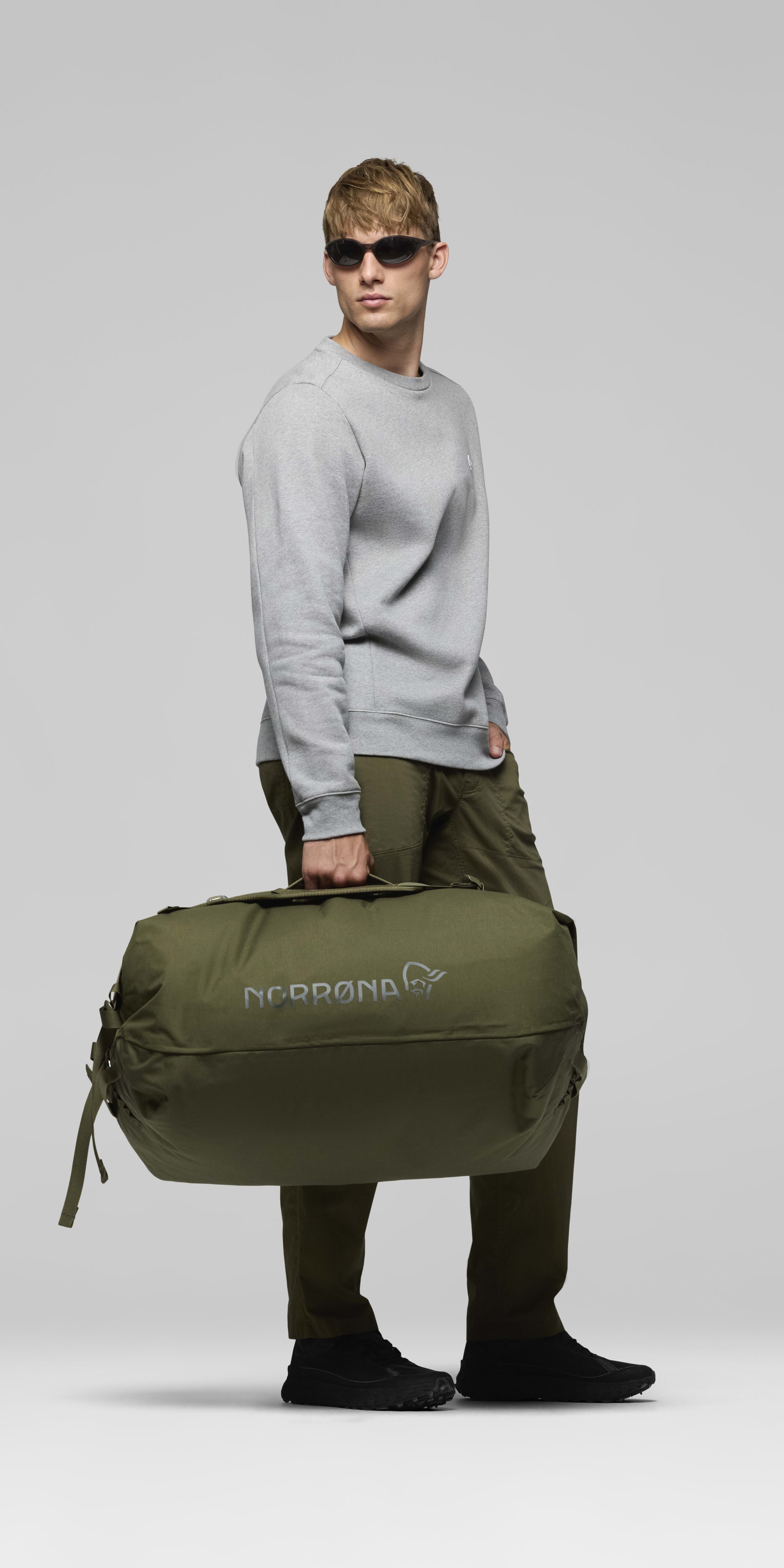 Female Look front image of norrona 90L Duffel Bag Olive Night
