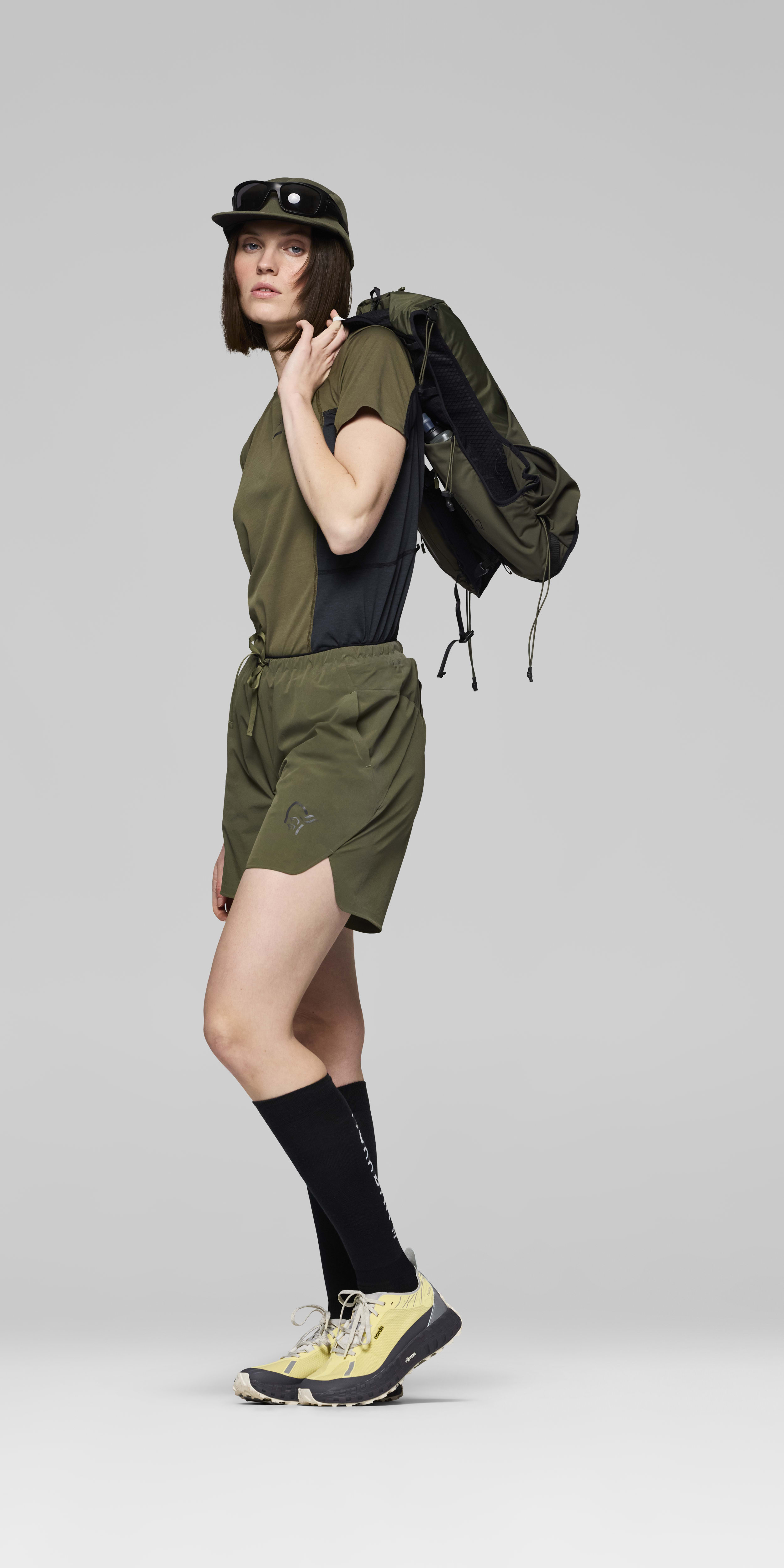 Female Look opening image of senja flex1 8" Shorts Olive Night