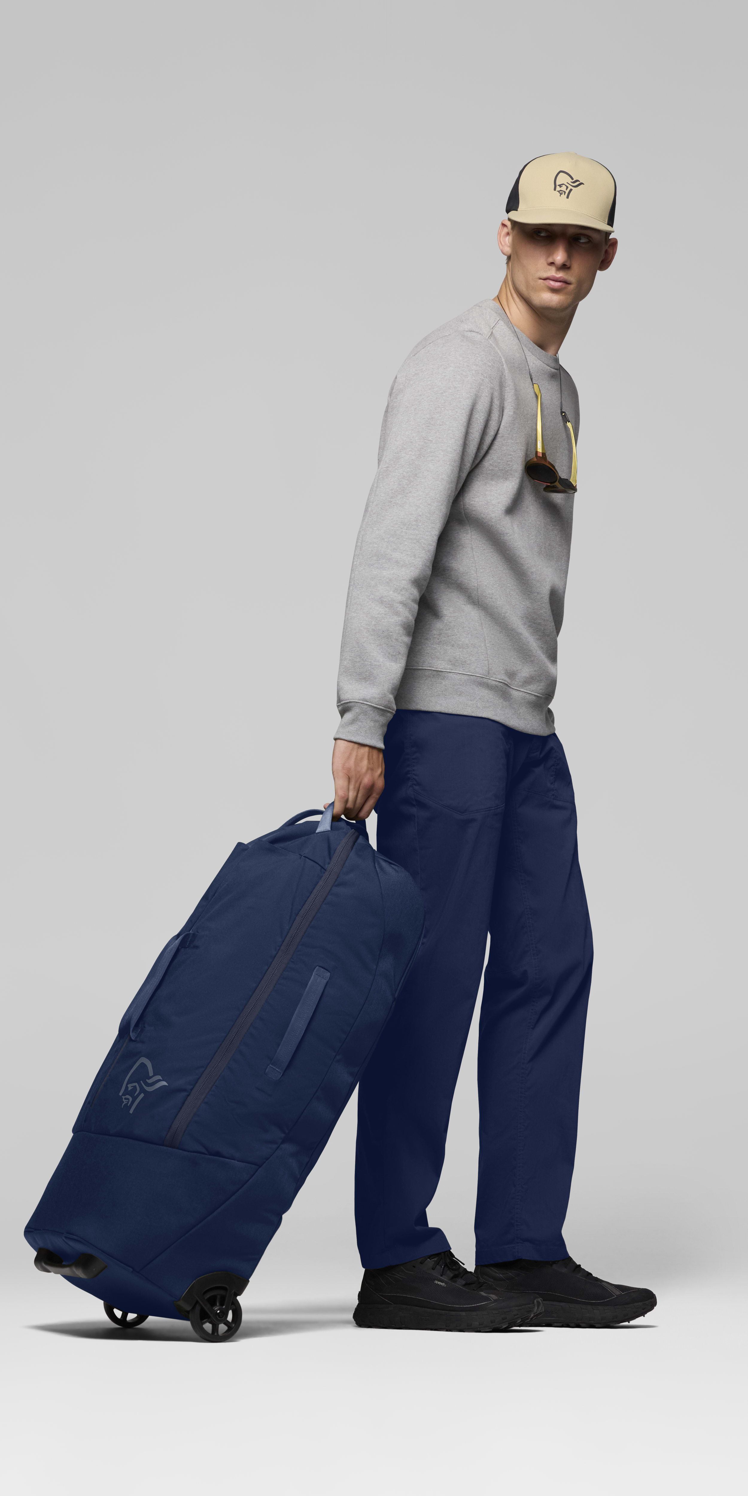 Female Look side image of norrona 80L Trolley Bag Indigo Night