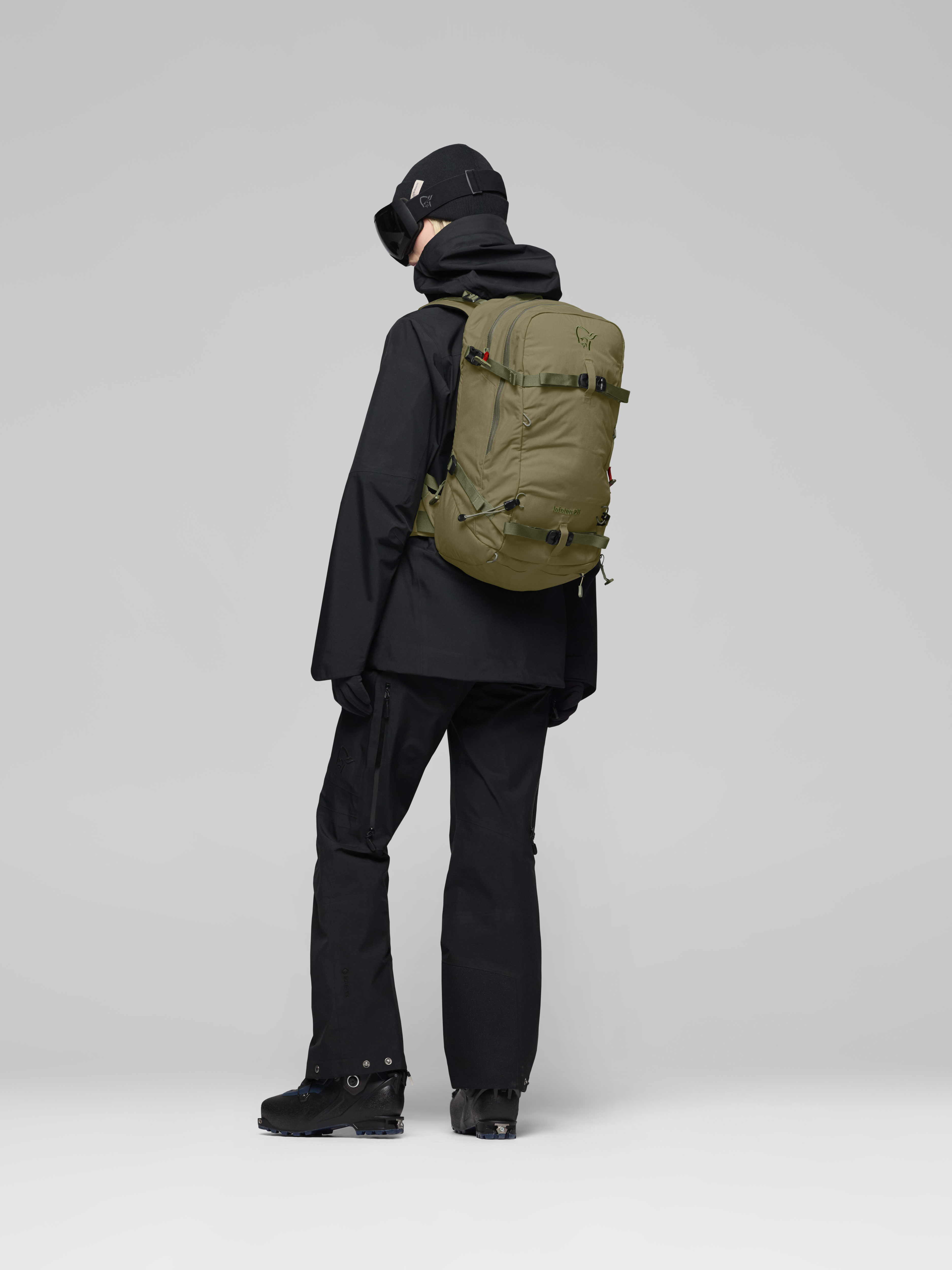 Female Look side image of lofoten 28L Pack Deep Lichen Green