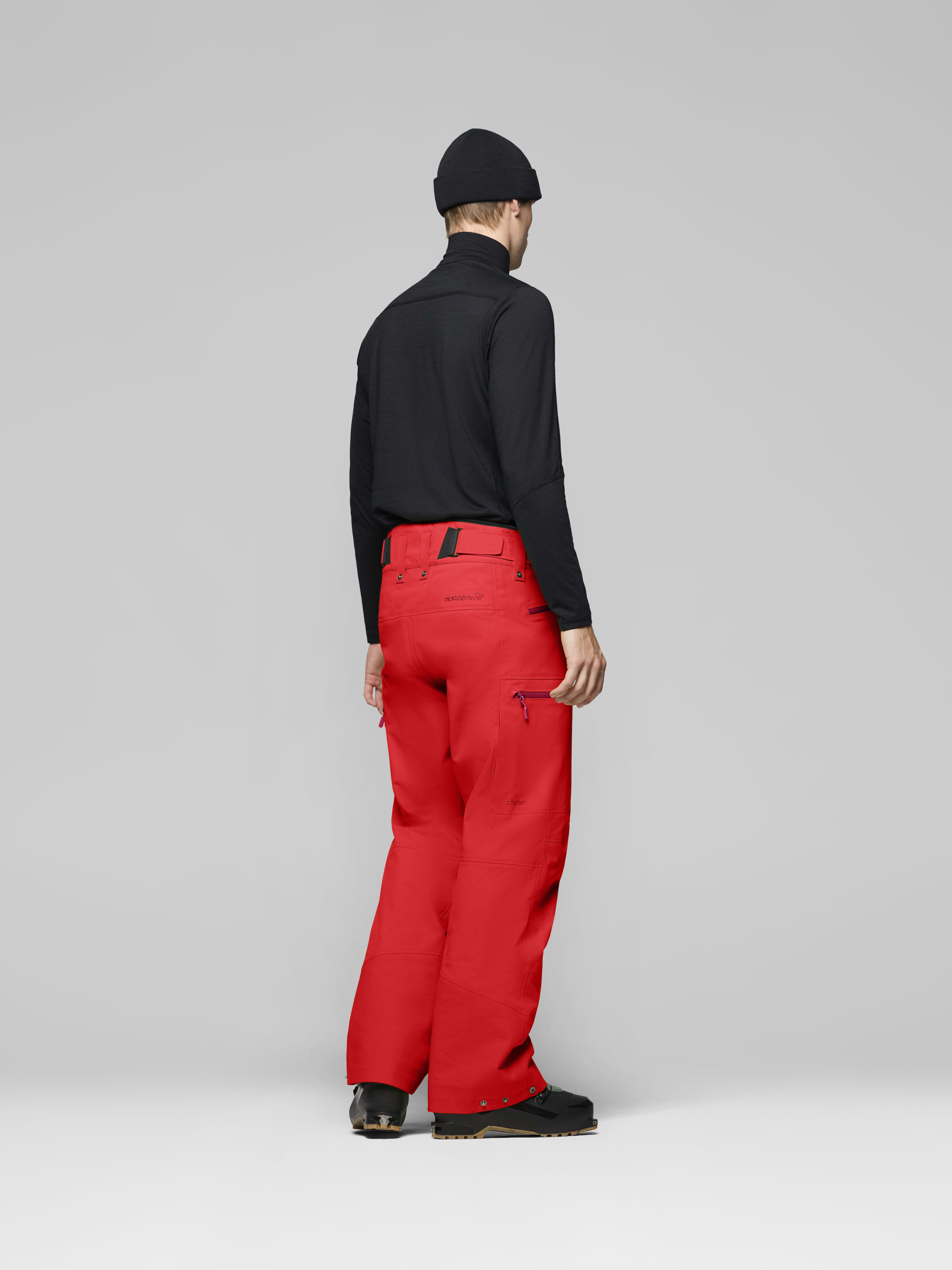 Male Look back image of lofoten Gore-Tex Pro Plus Pants Fiery Red
