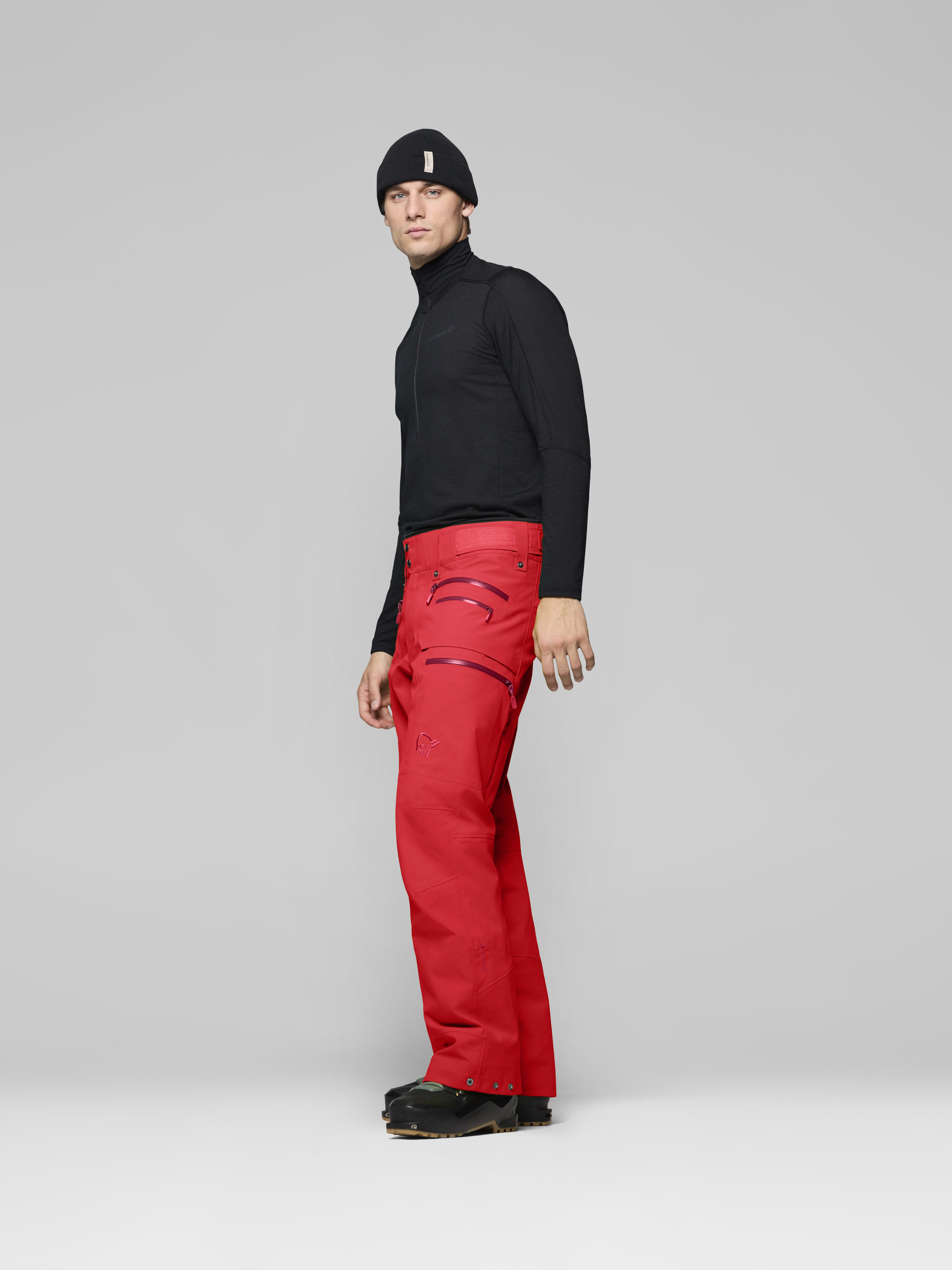 Male Look side image of lofoten Gore-Tex Pro Plus Pants Fiery Red