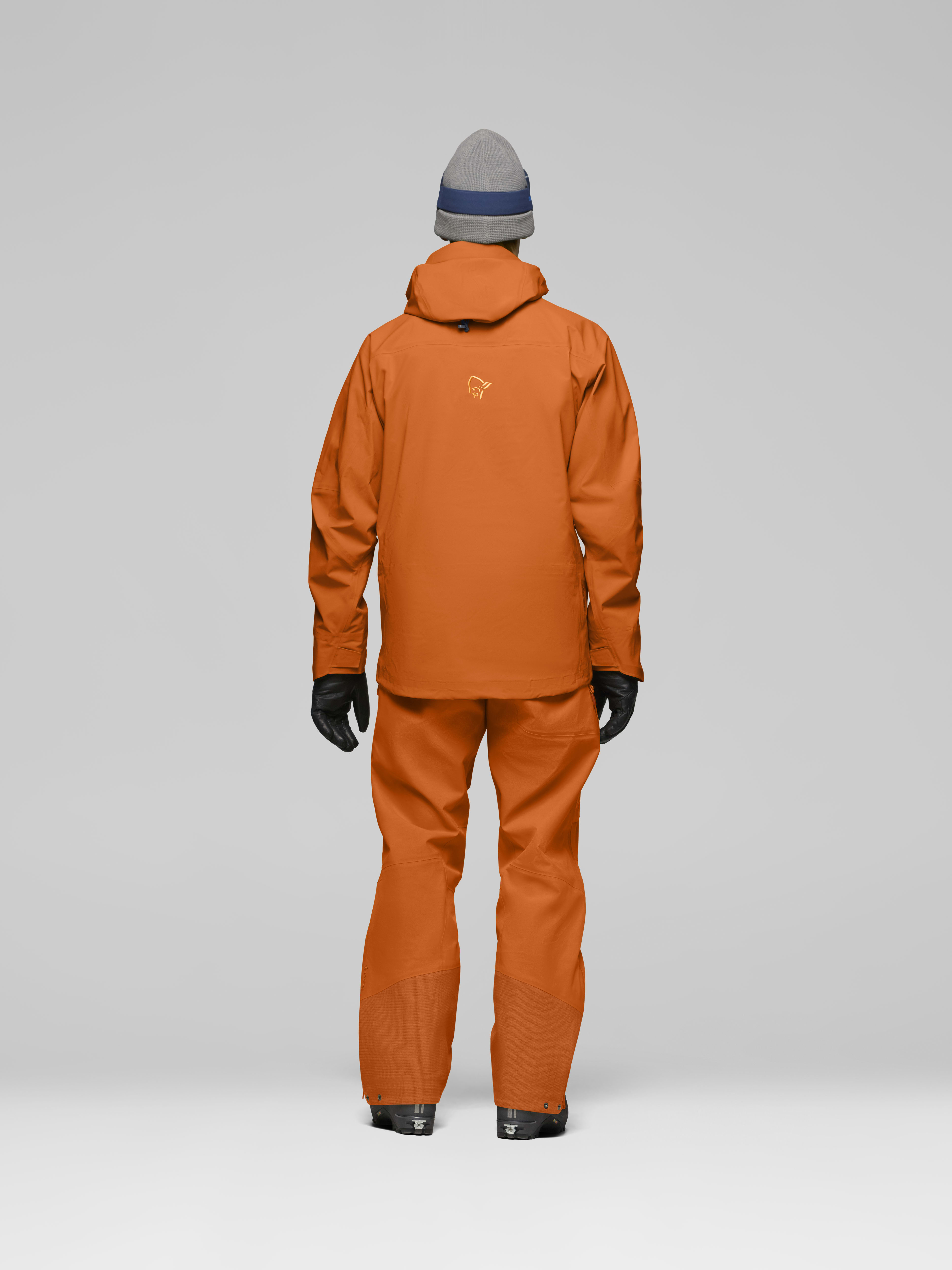 Male Look back image of lofoten Gore-Tex Pro Jacket Gold Flame