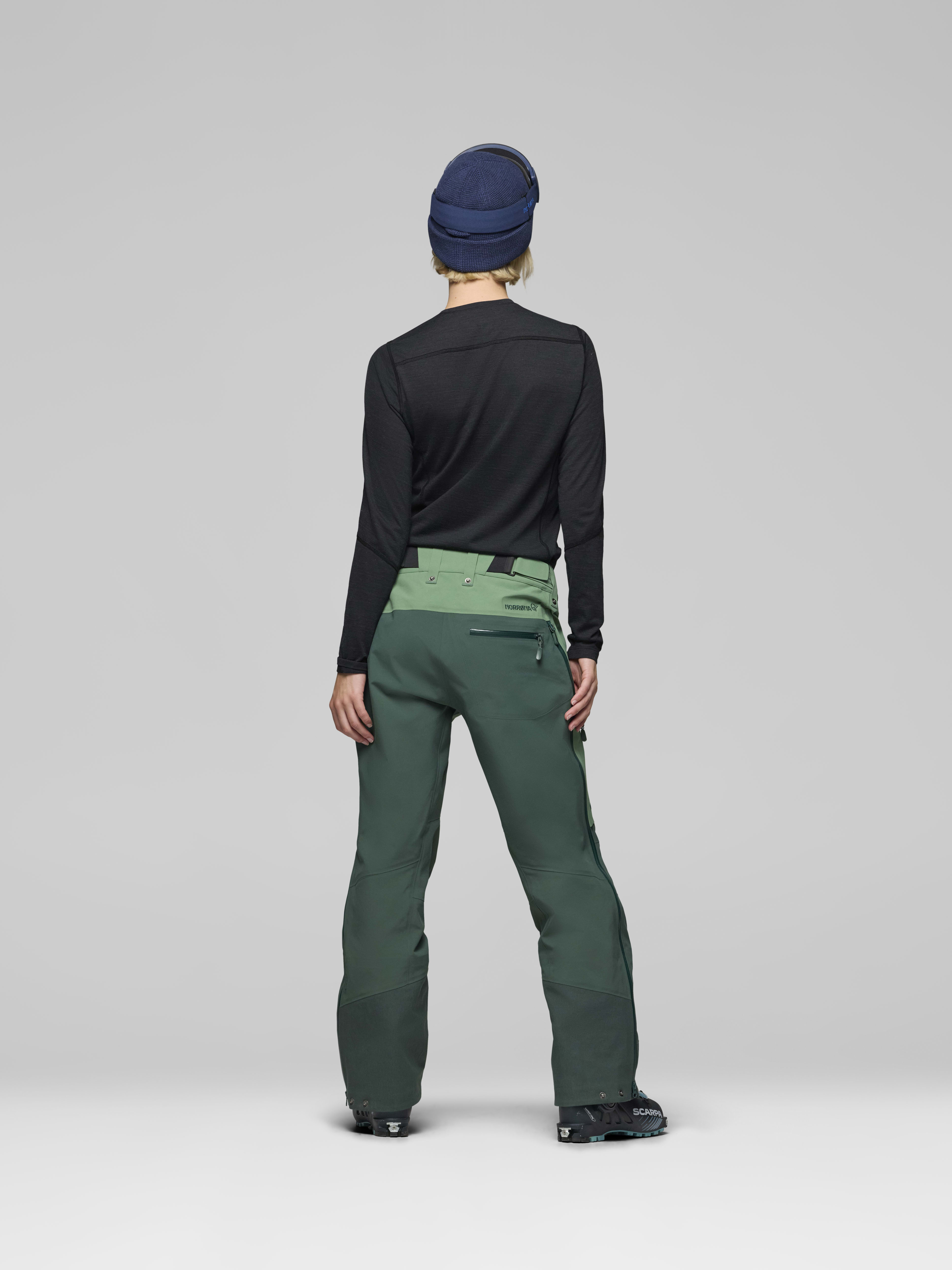 Female Look back image of lofoten Gore-Tex Pro Pants Dark Ivy