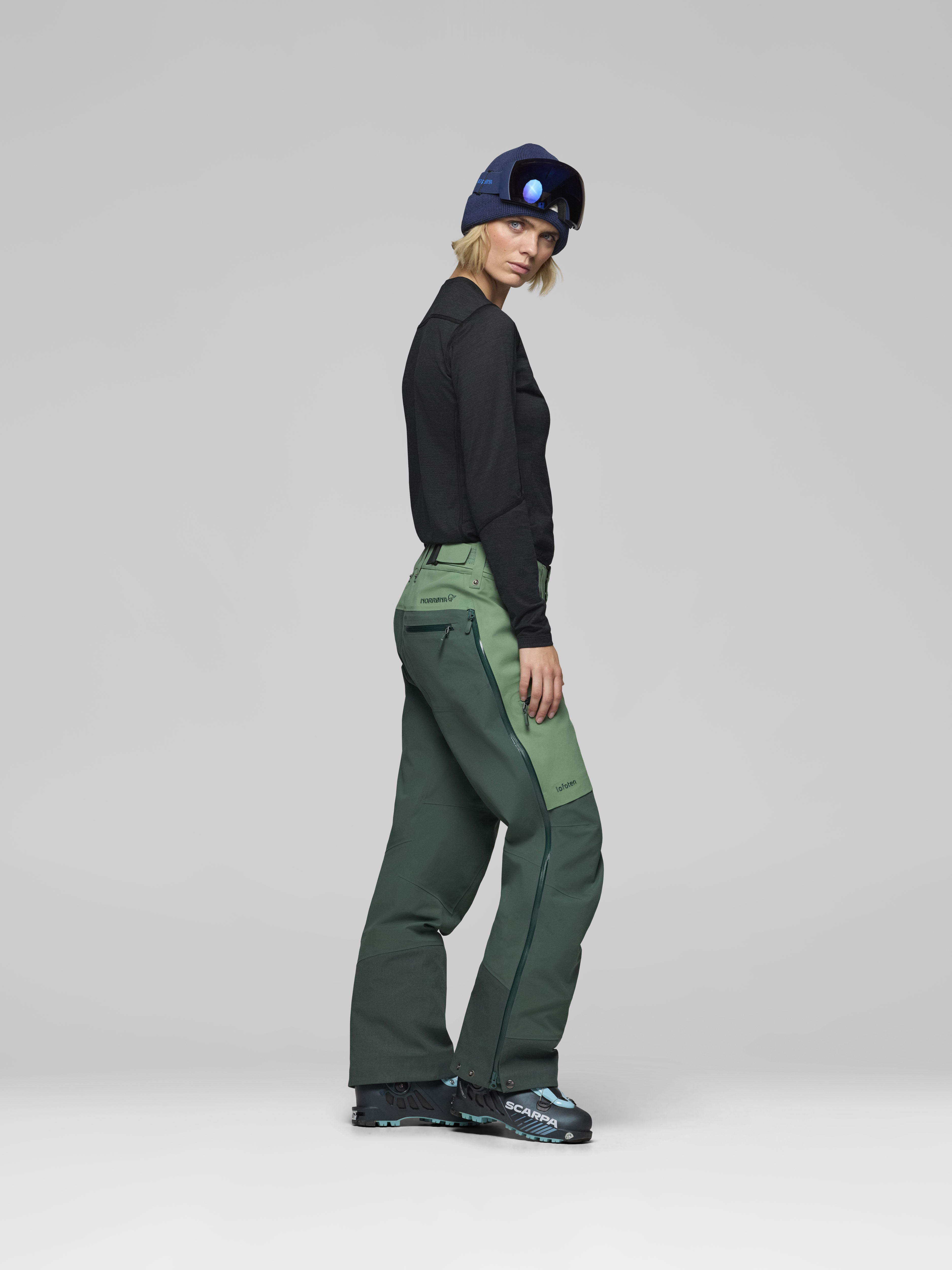 Female Look side image of lofoten Gore-Tex Pro Pants Dark Ivy