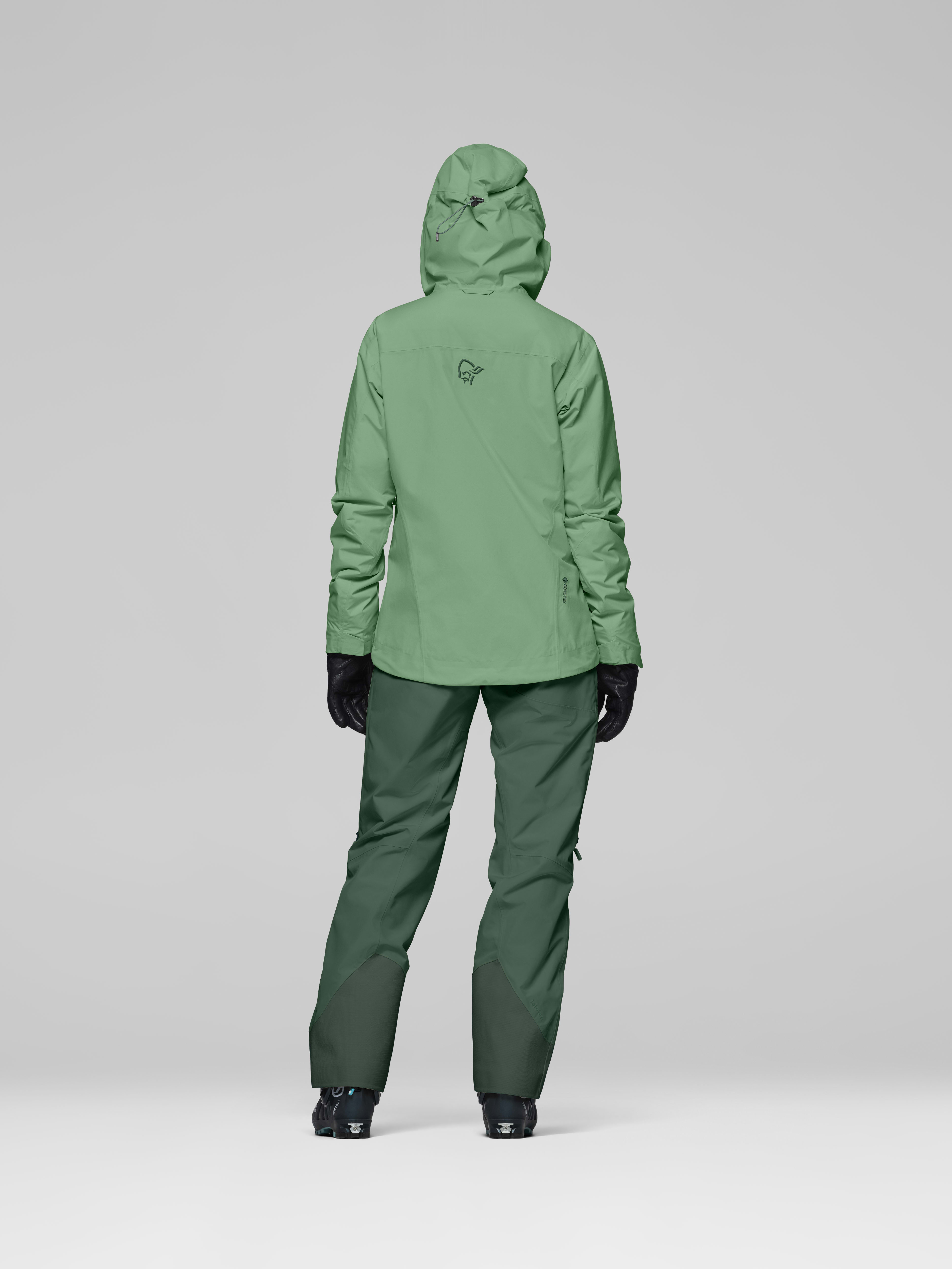 Female Look back image of lofoten Gore-Tex Insulated Jacket Dark Ivy