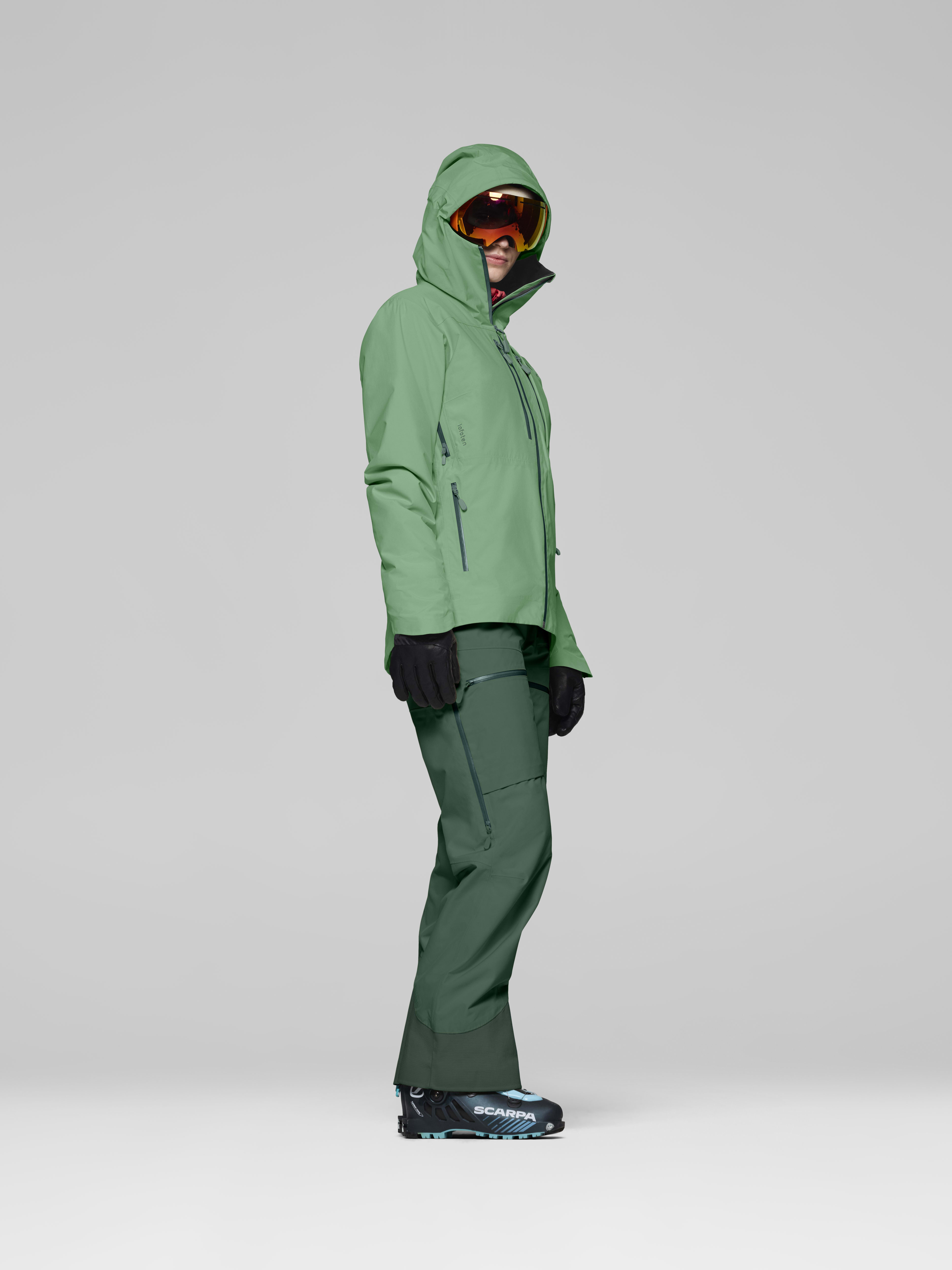 Female Look side image of lofoten Gore-Tex Insulated Jacket Dark Ivy