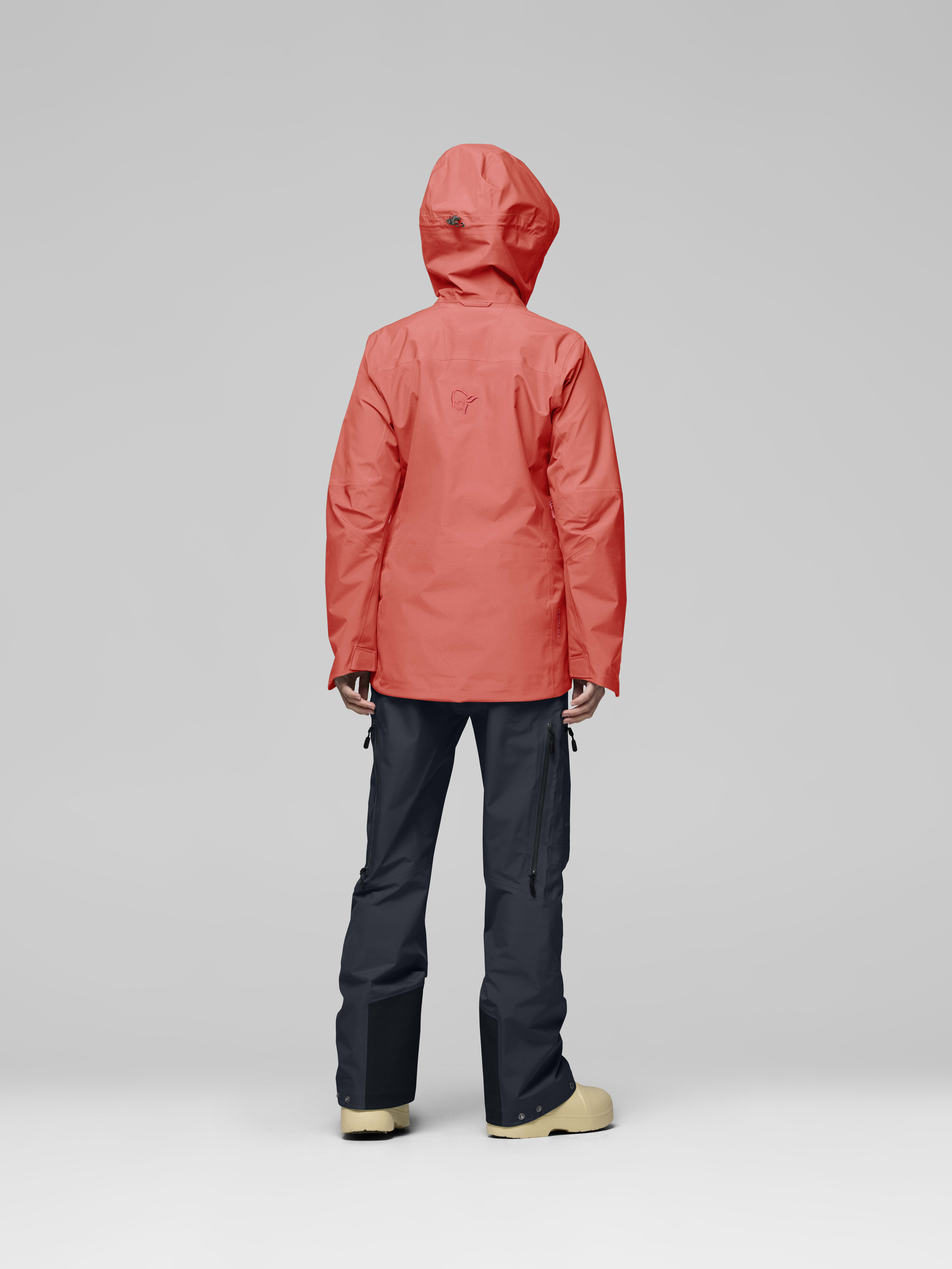 Female Look back image of lofoten Gore-Tex Jacket Deep Sea Coral