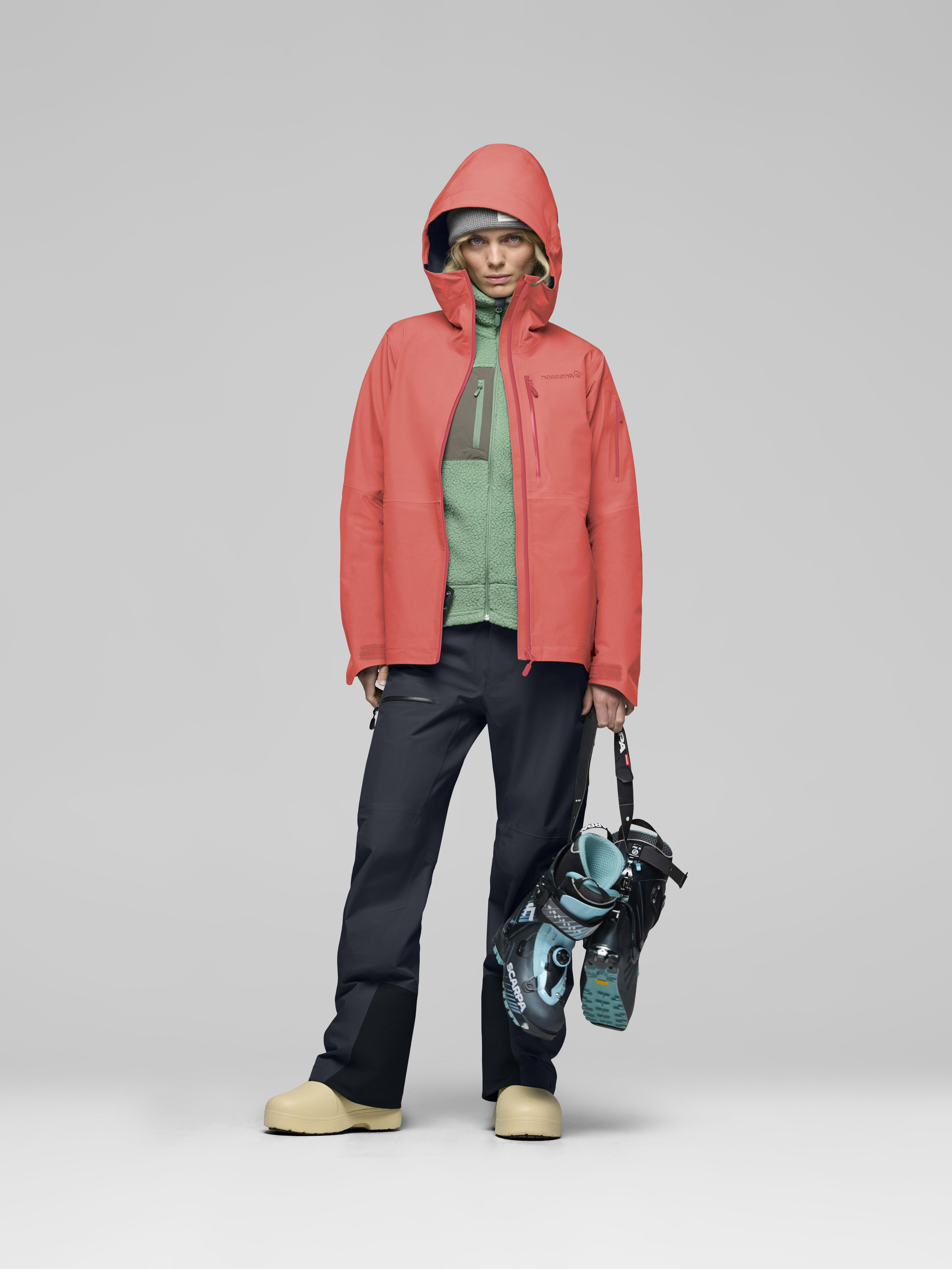 Female Look opening image of lofoten Gore-Tex Jacket Deep Sea Coral
