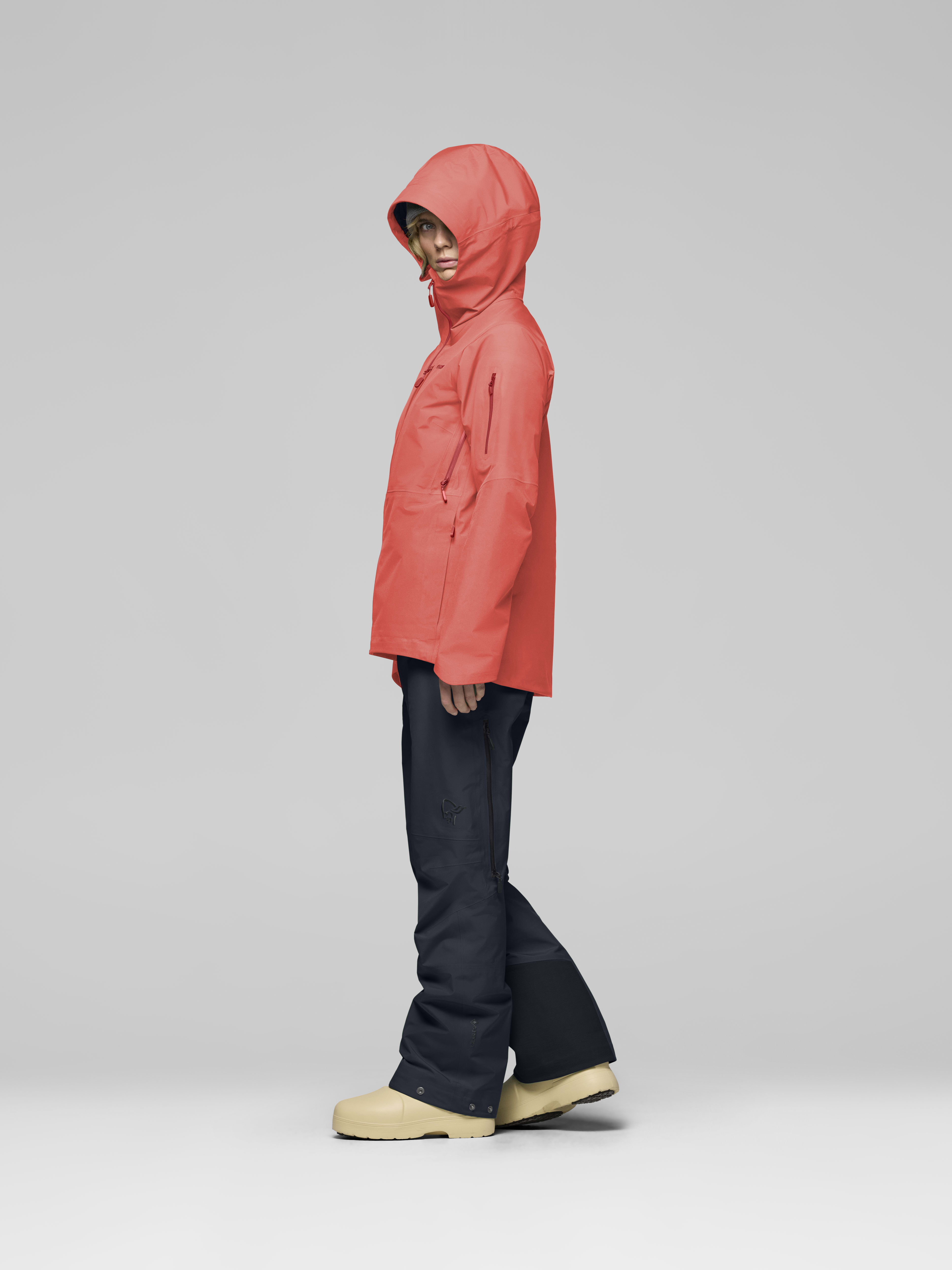Female Look side image of lofoten Gore-Tex Jacket Deep Sea Coral