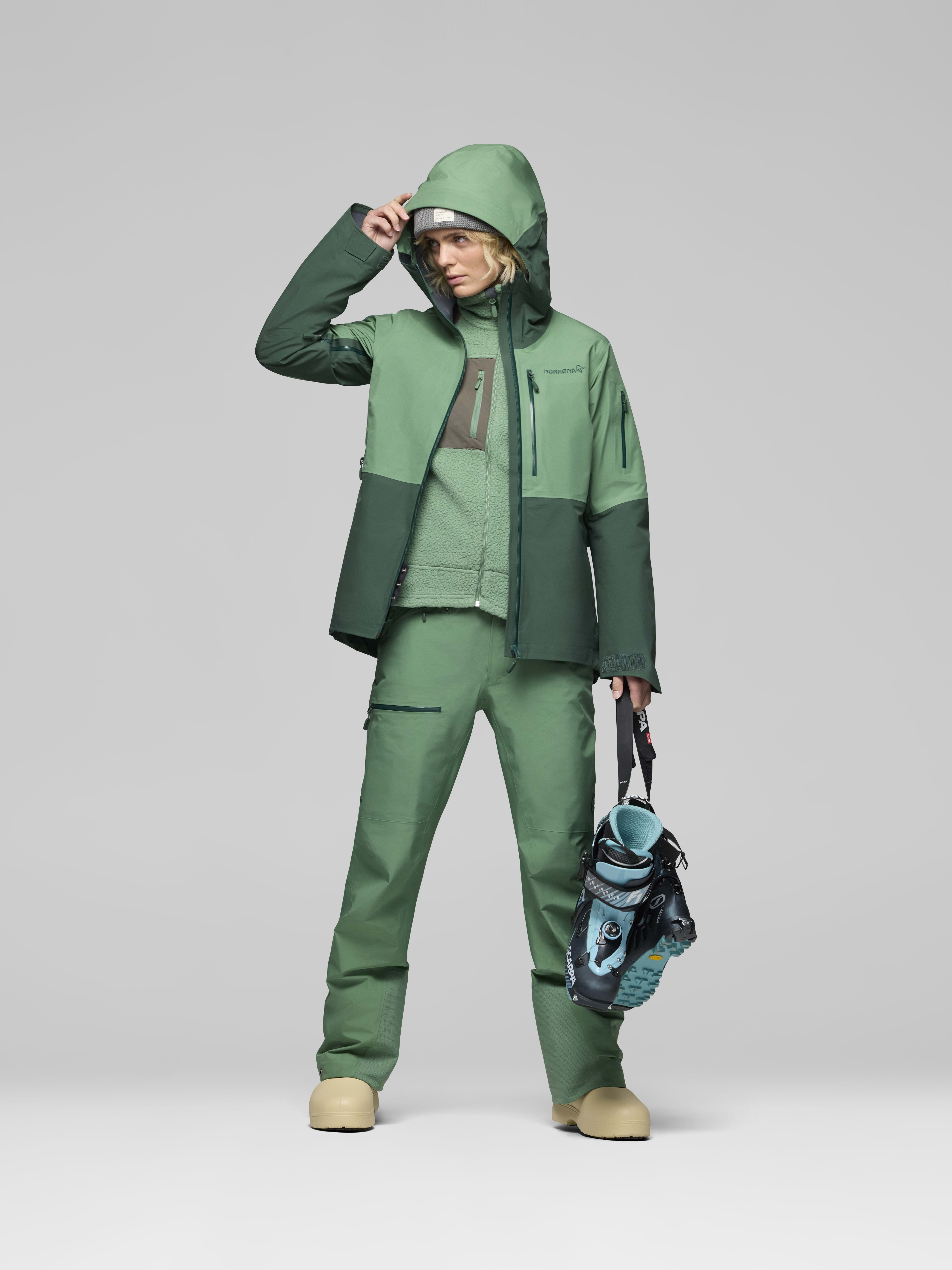 Female Look opening image of lofoten Gore-Tex Pants Dark Ivy