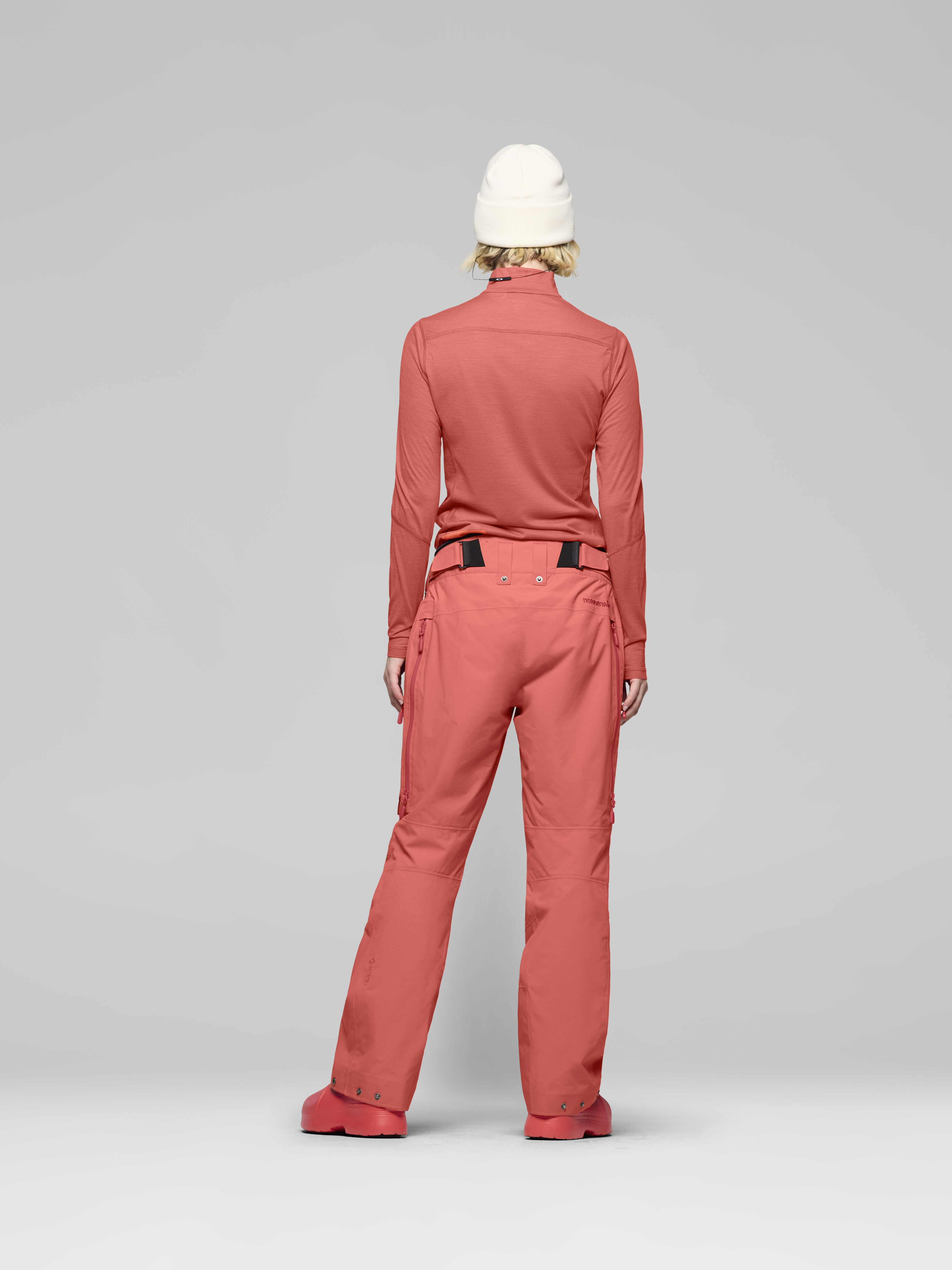 Female Look back image of lofoten Gore-Tex thermo60 Pants Deep Sea Coral