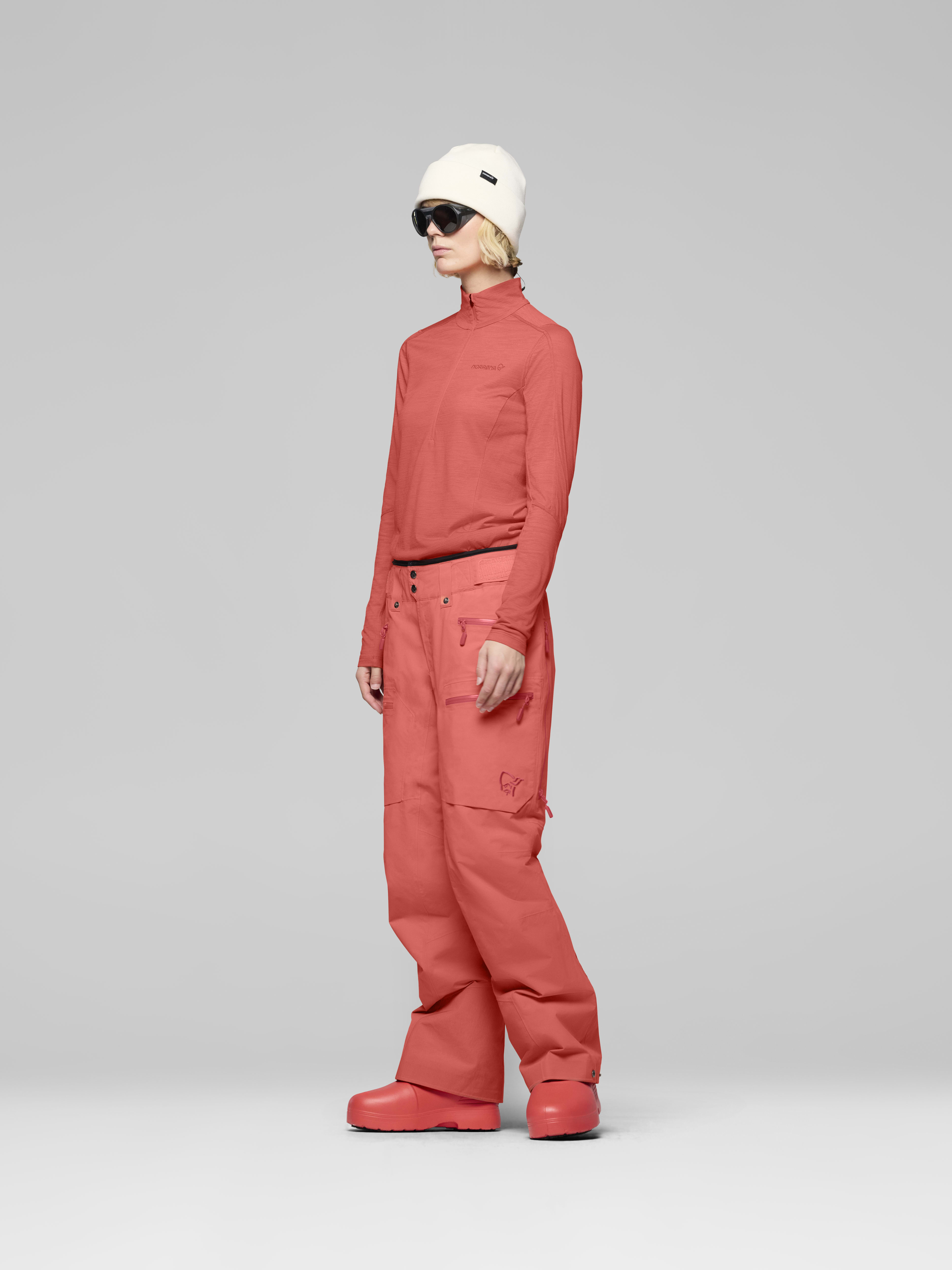 Female Look side image of lofoten Gore-Tex thermo60 Pants Deep Sea Coral