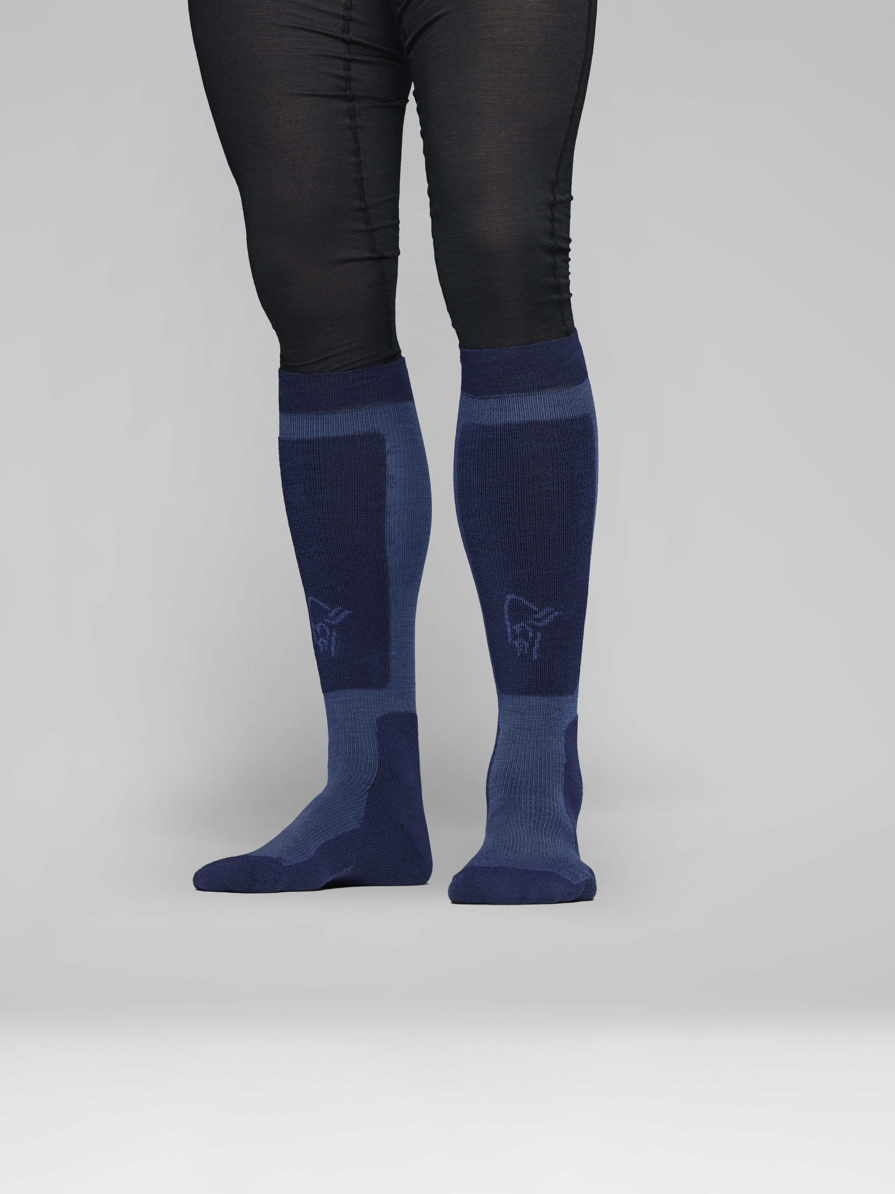 Female Look side image of lofoten mid merinoUll long Socks Indigo Night/Dark Denim