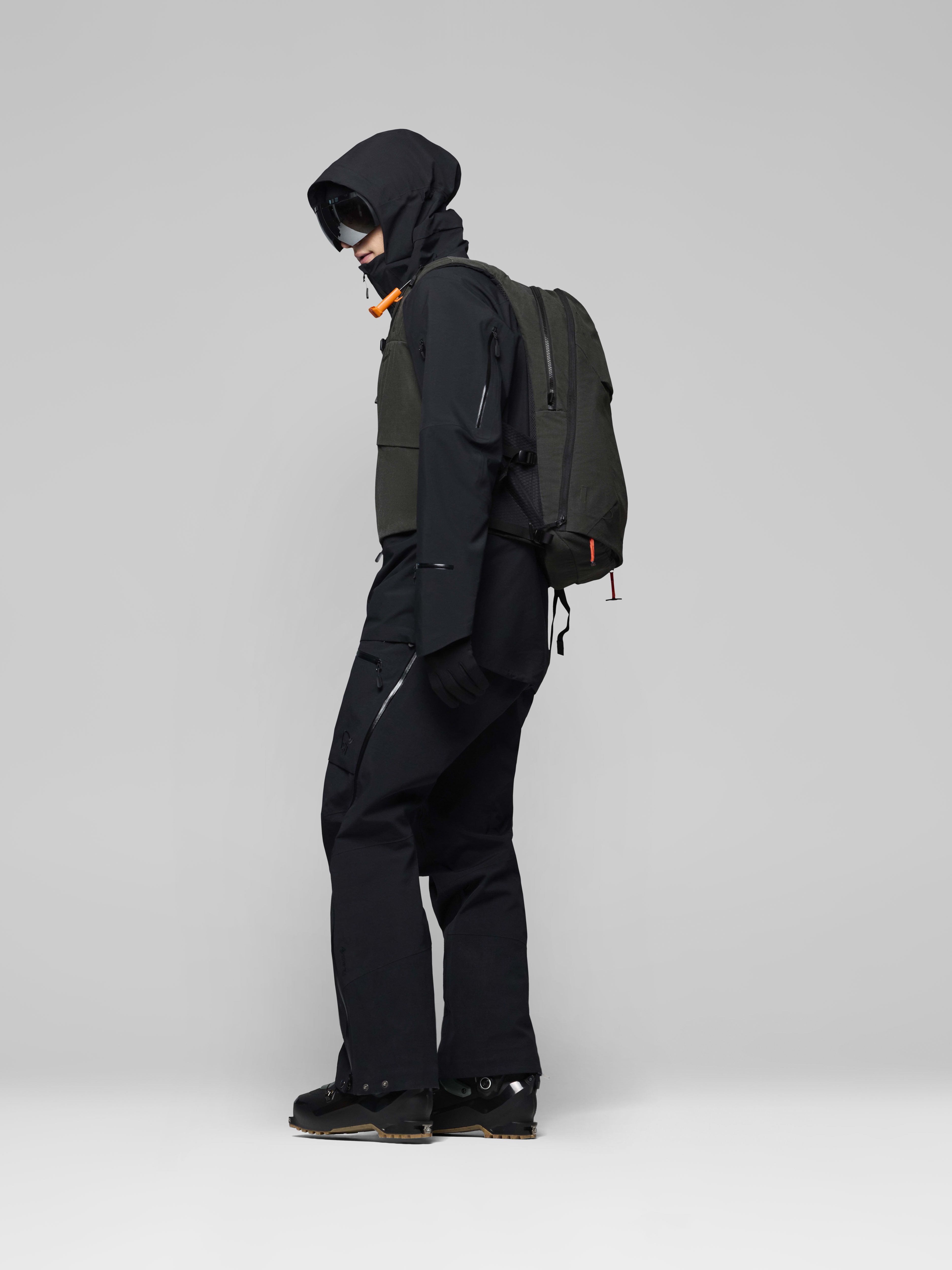 Female Look side image of lofoten Avi ACE 15L Pack Caviar Black