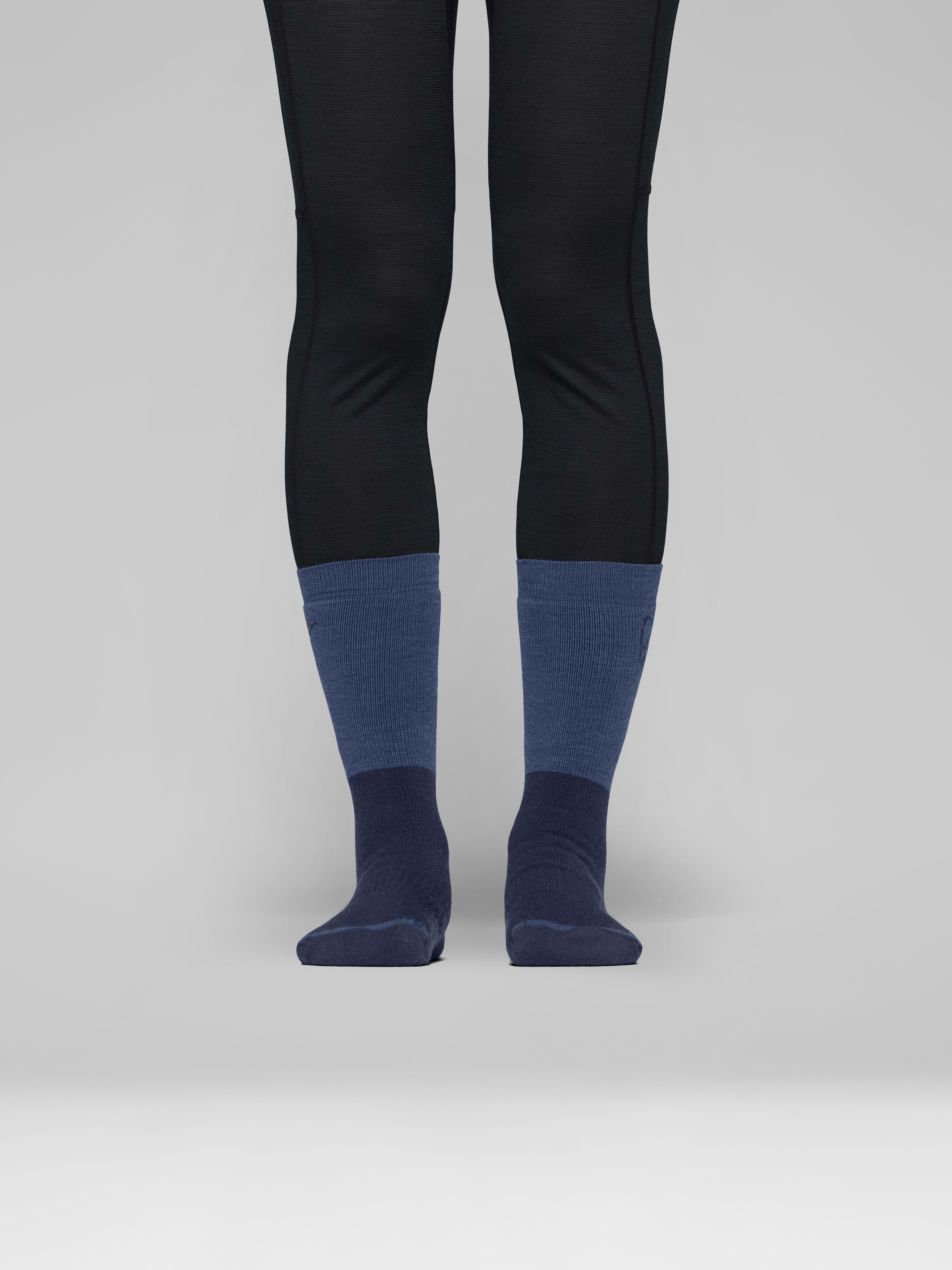 Female Look front image of trollveggen heavy merinoUll Socks Indigo Night/Dark Denim