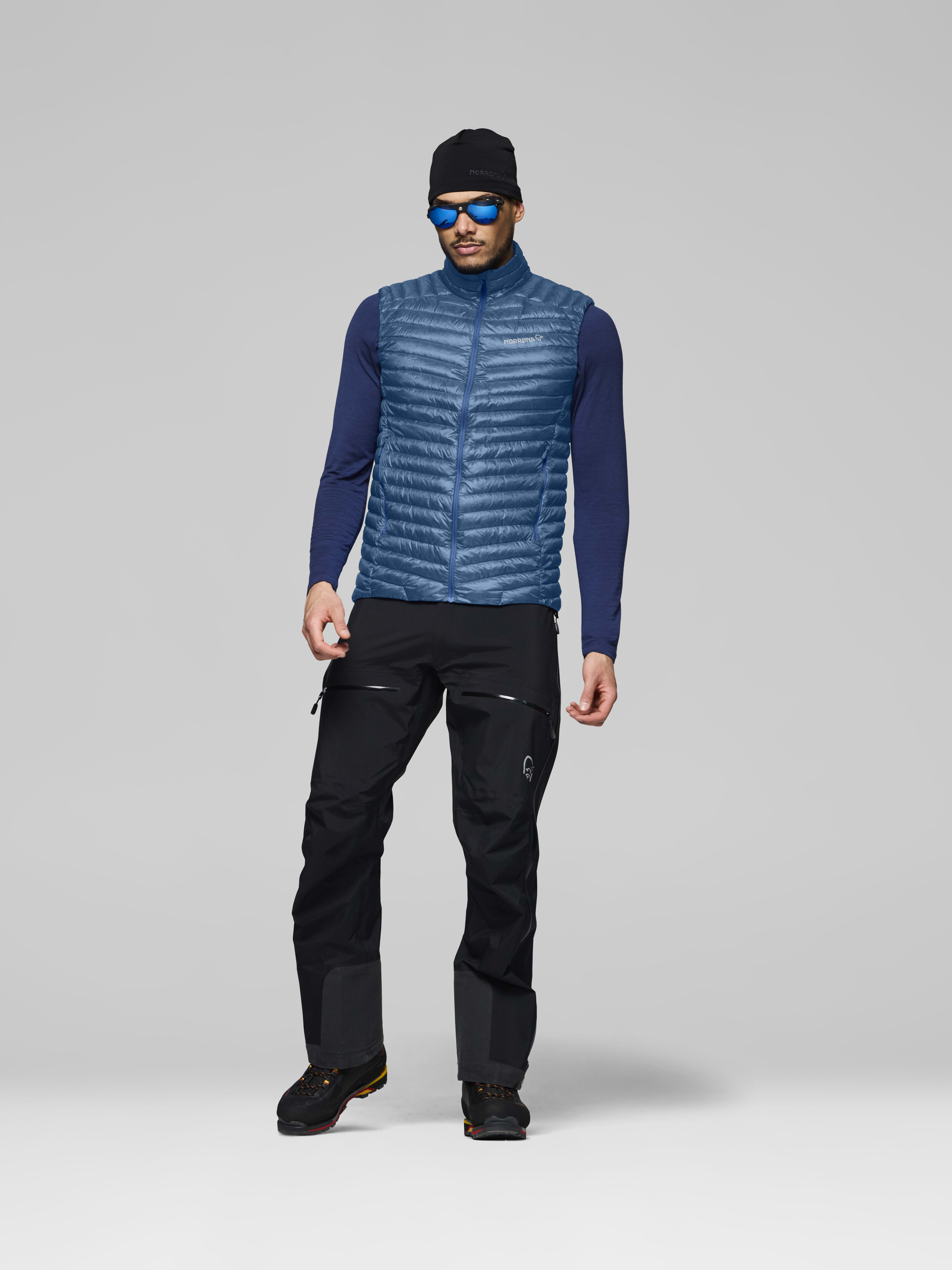 Male Look front image of trollveggen down800 super light Vest Dark Blue