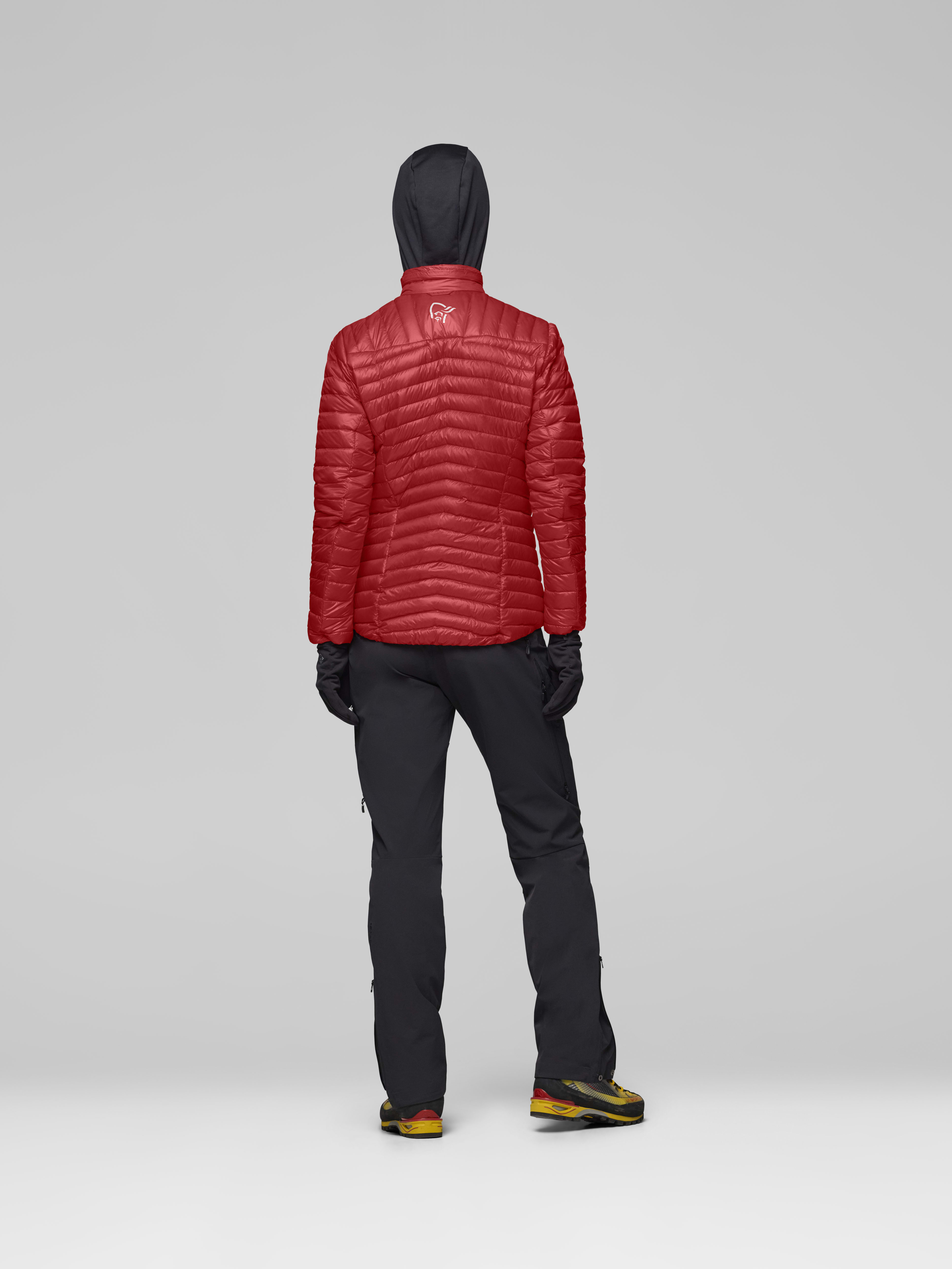 Female Look back image of trollveggen down800 super light Jacket Baked Apple
