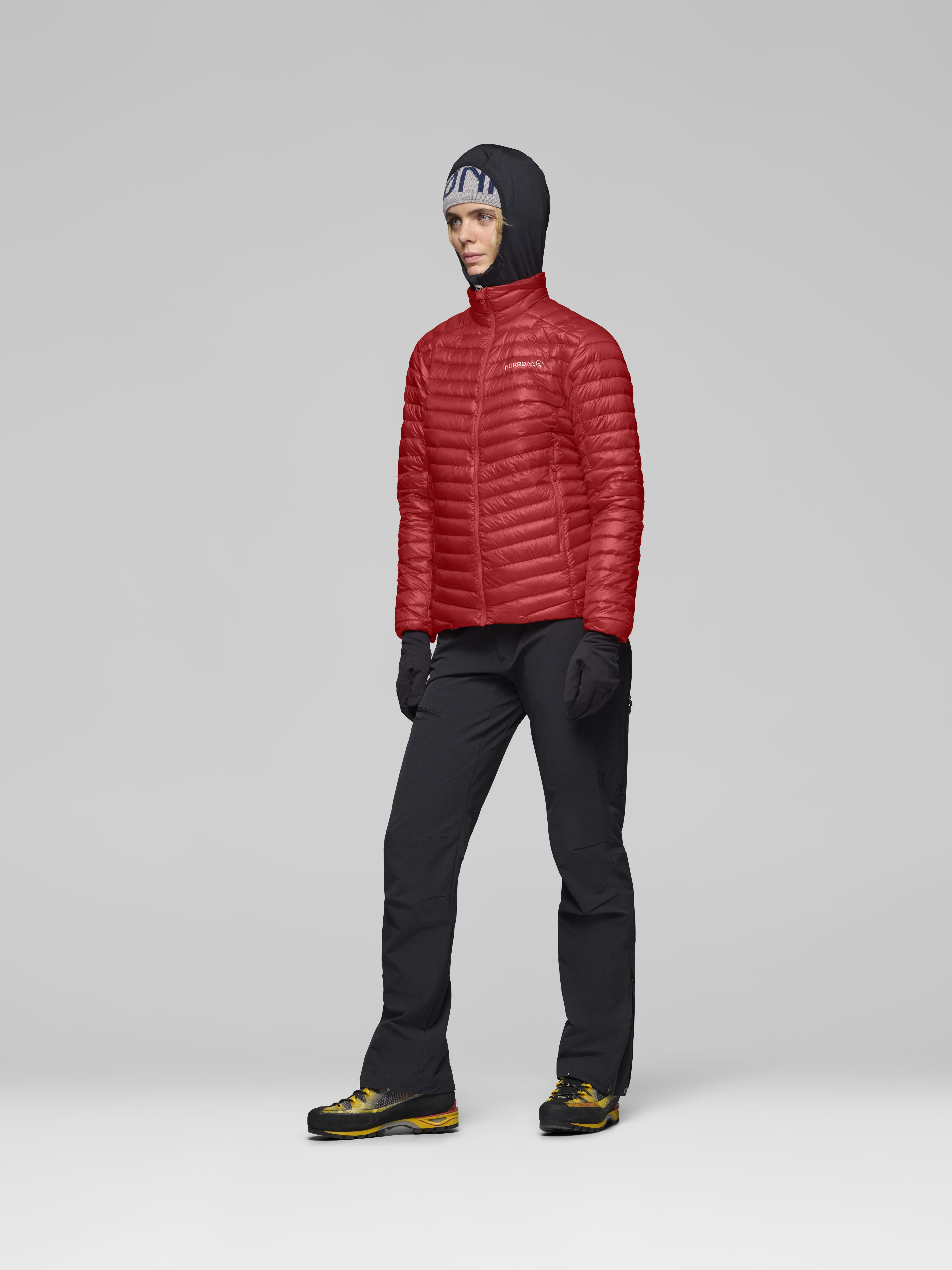 Female Look side image of trollveggen down800 super light Jacket Baked Apple