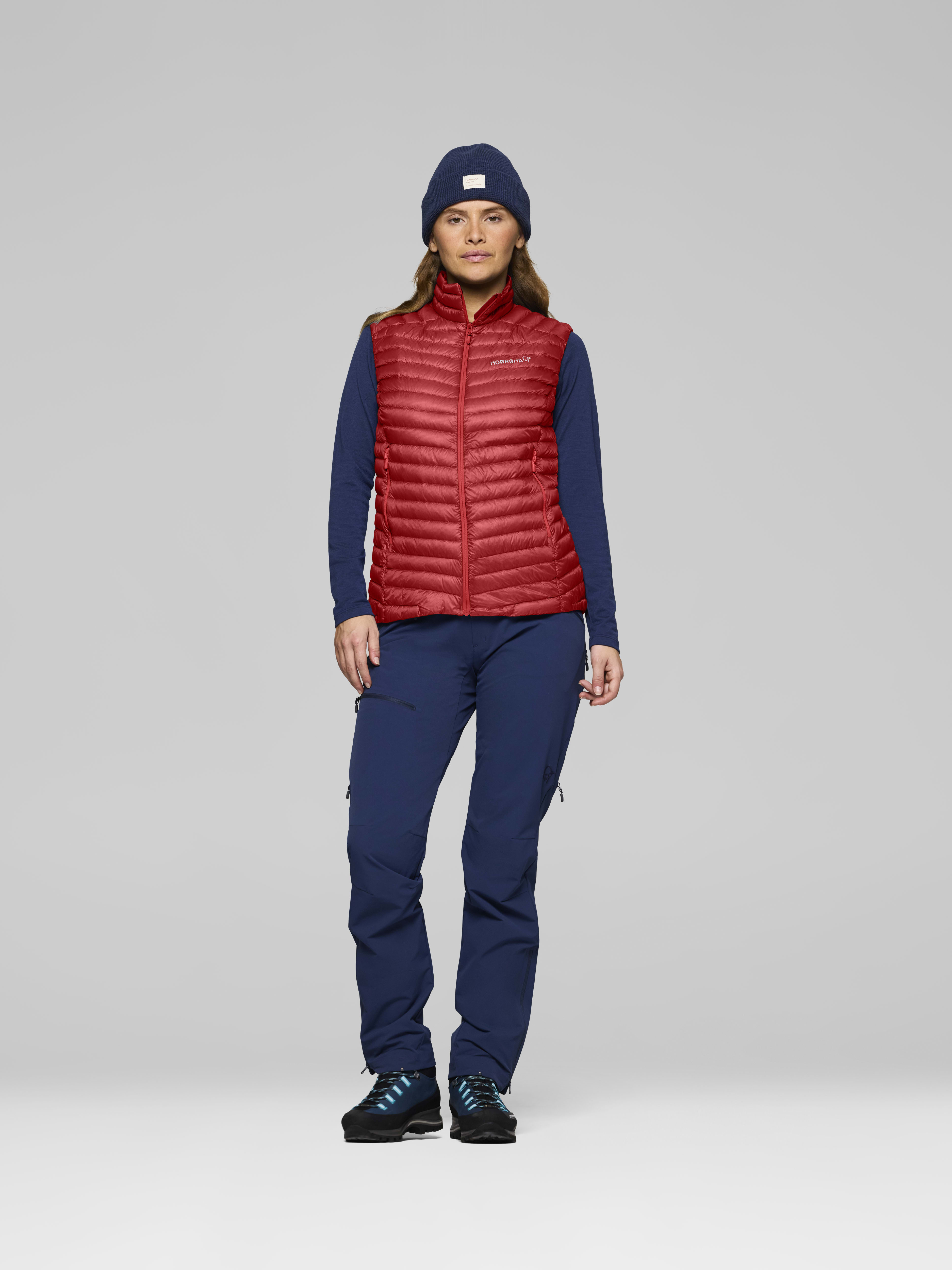 Female Look front image of trollveggen down800 super light Vest Baked Apple