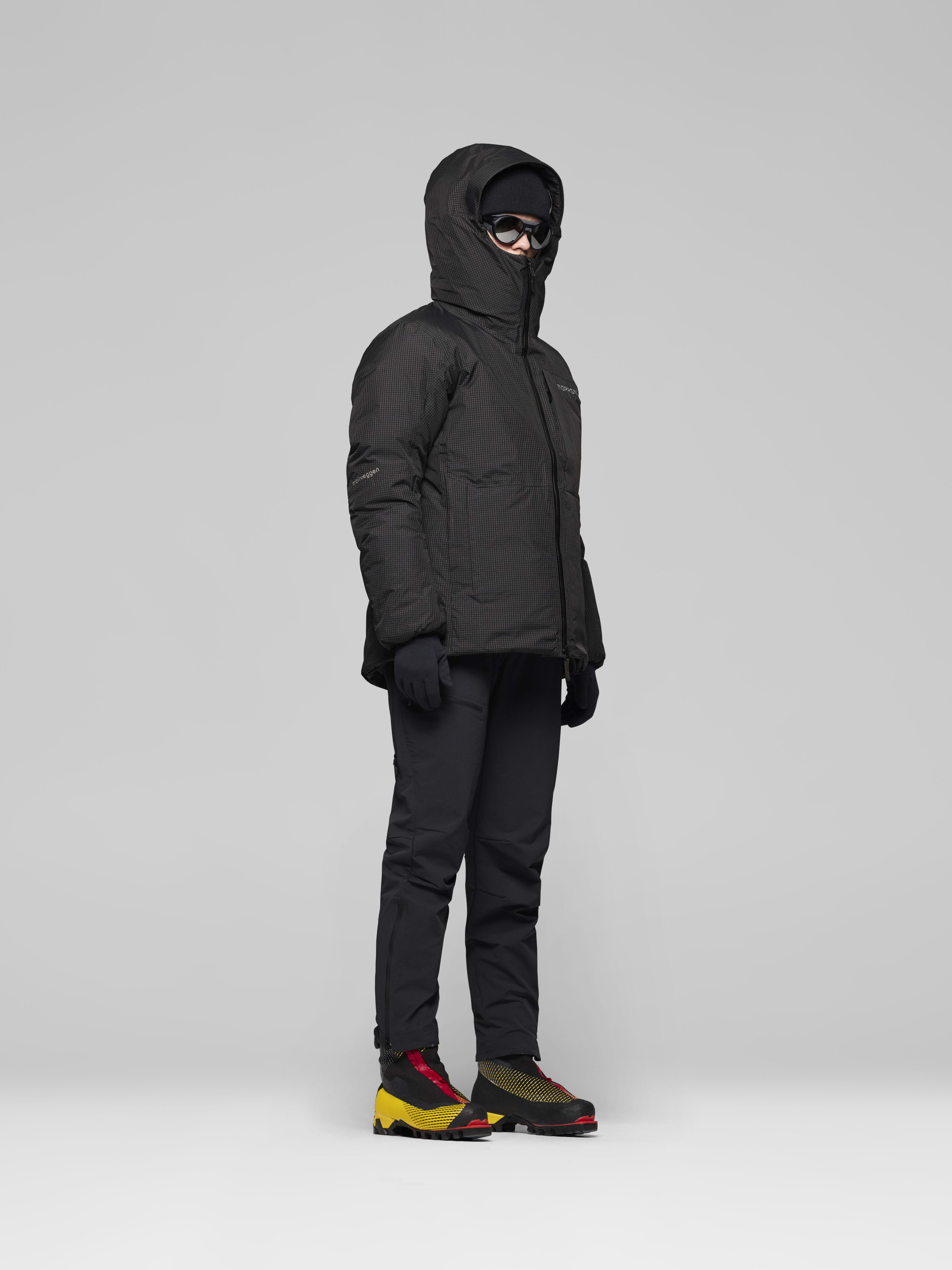 Female Look side image of trollveggen dri2 down800 Zip Hood Caviar Black