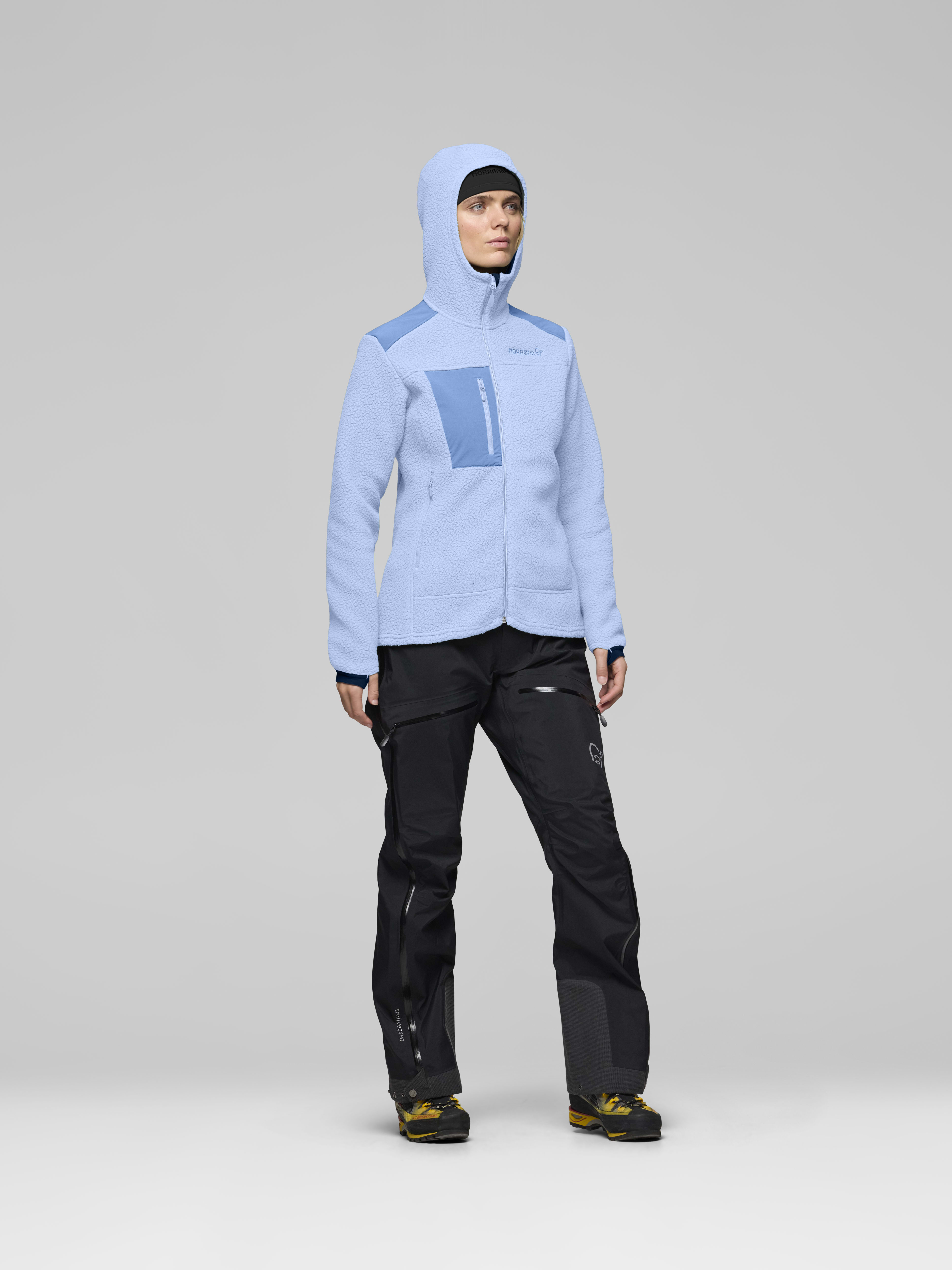 Female Look side image of trollveggen warm3 Zip Hood Cashmere Blue/Allure