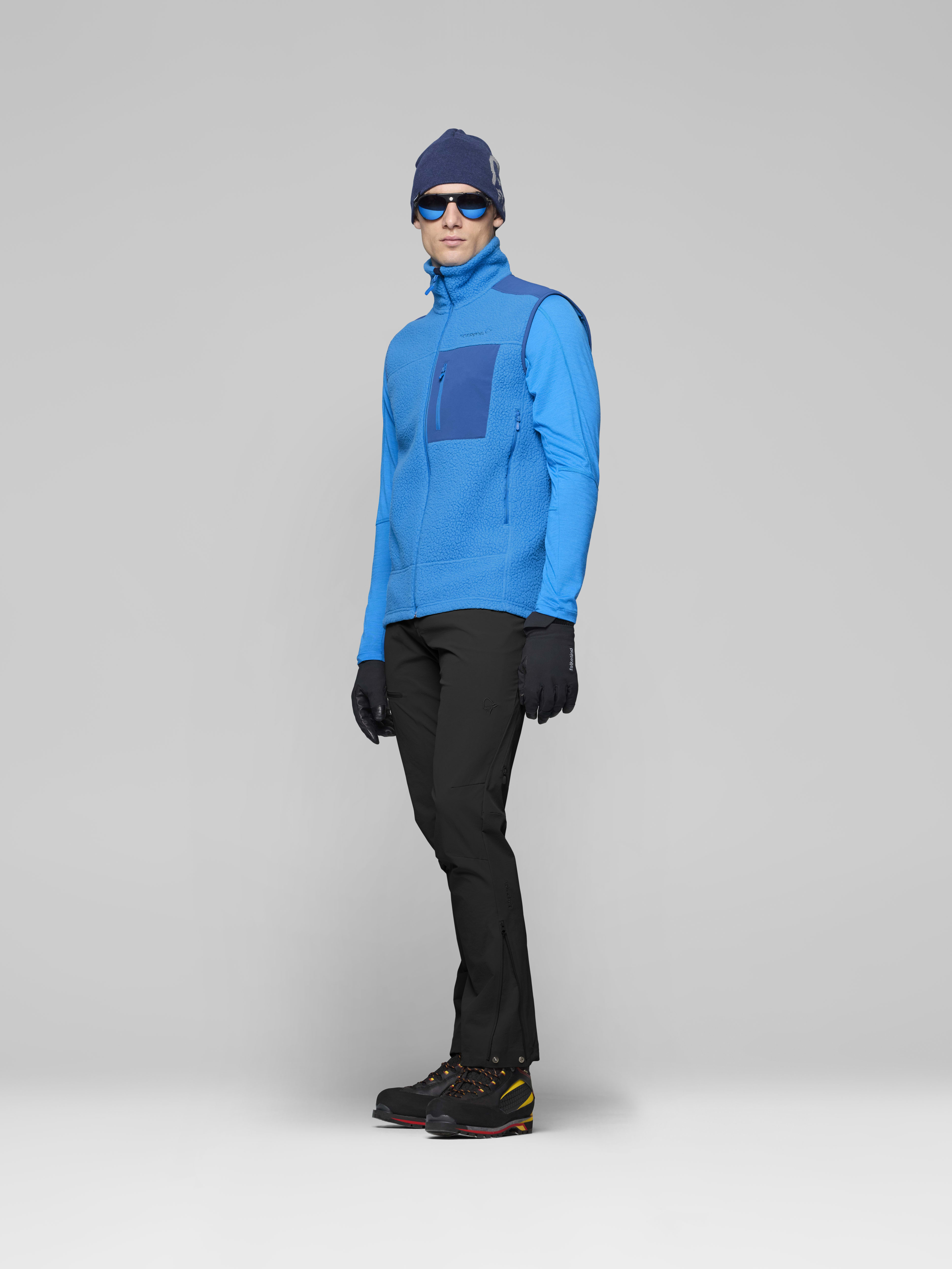 Male Look side image of trollveggen warm3 Vest Brilliant Blue/Dark Blue