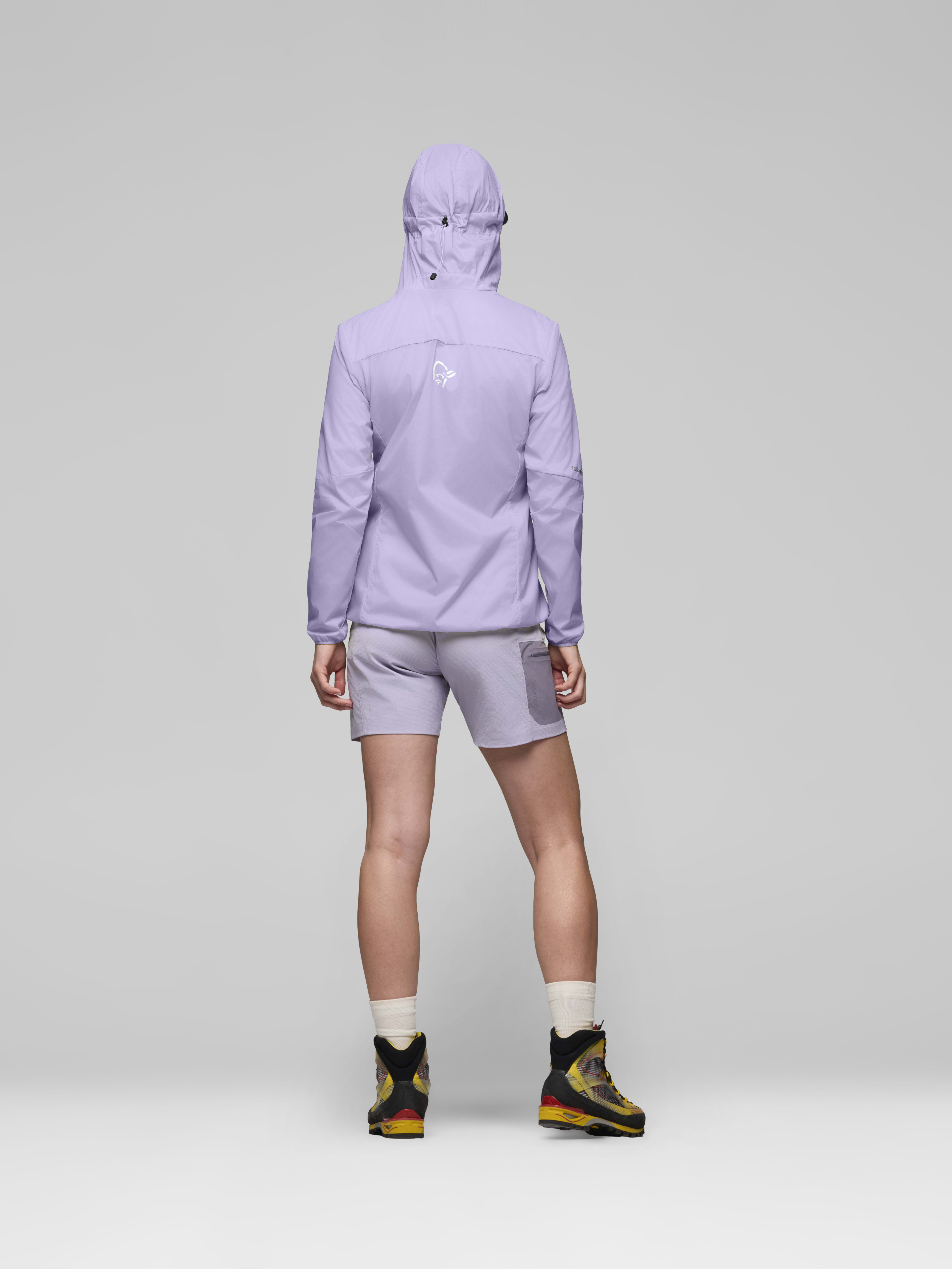 Female Look back image of falketind aero60 Zip Hood Heirloom Lilac