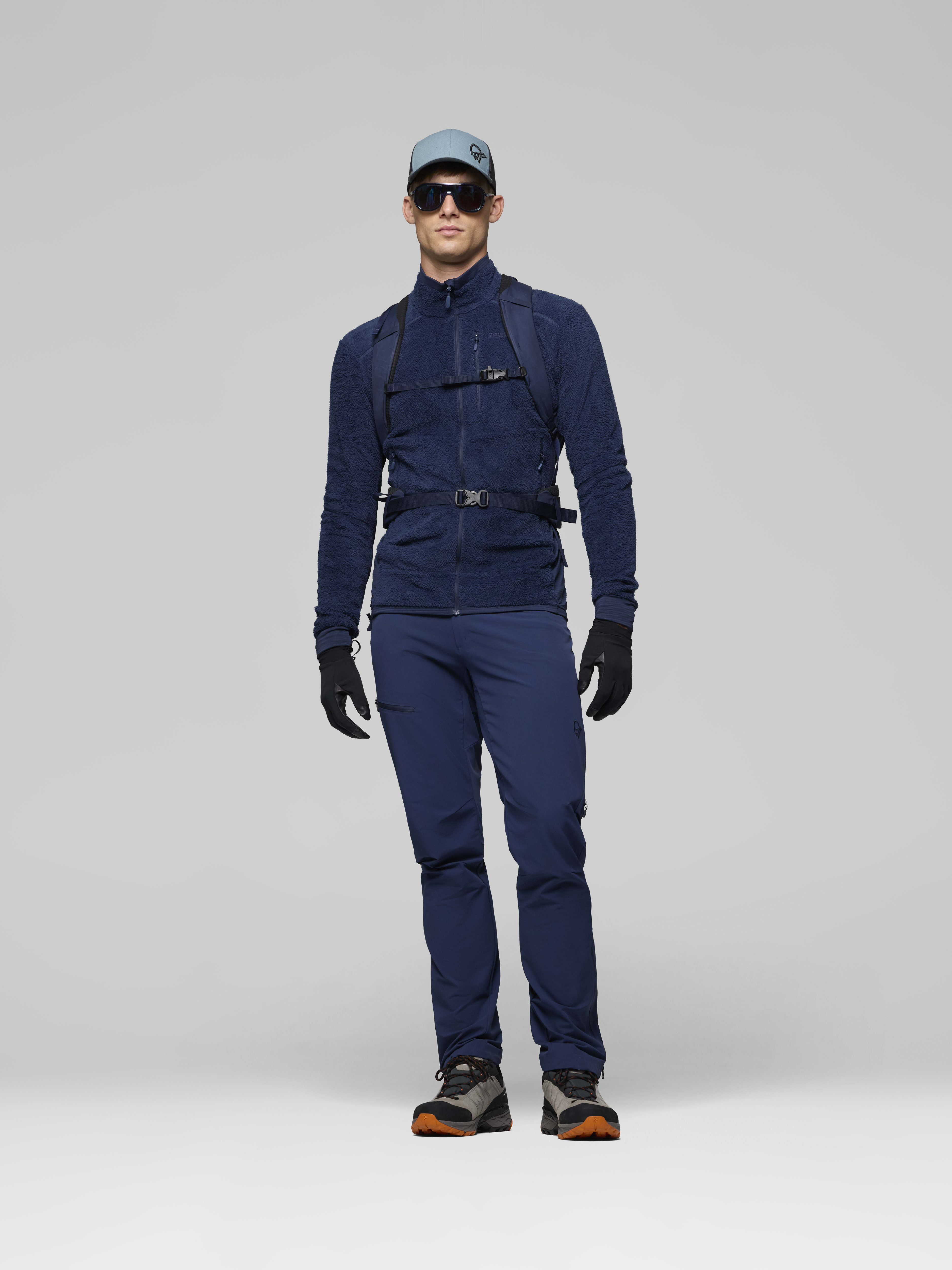Female Look back image of falketind econyl70 28L Pack Indigo Night