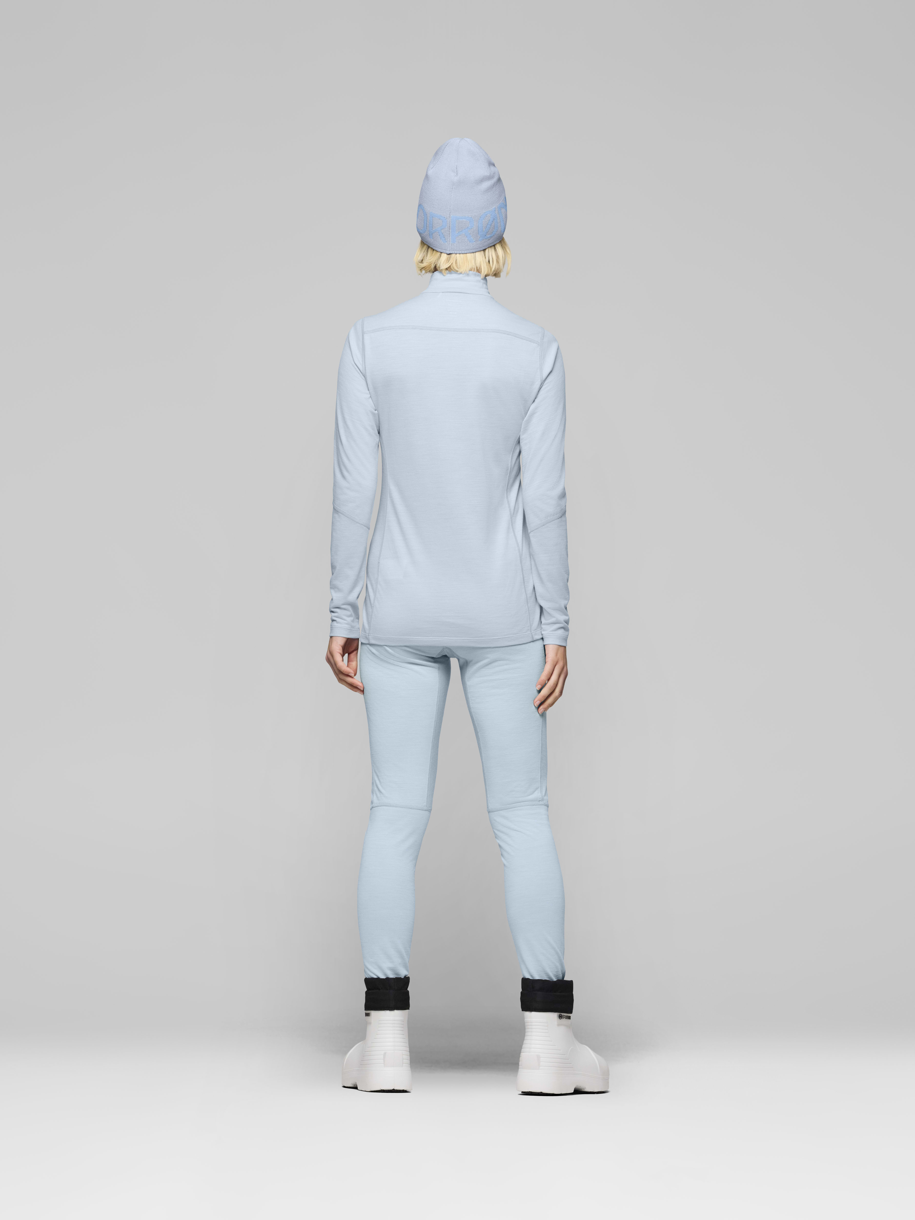 Female Look back image of falketind equaliserUll Zip Neck Cashmere Blue