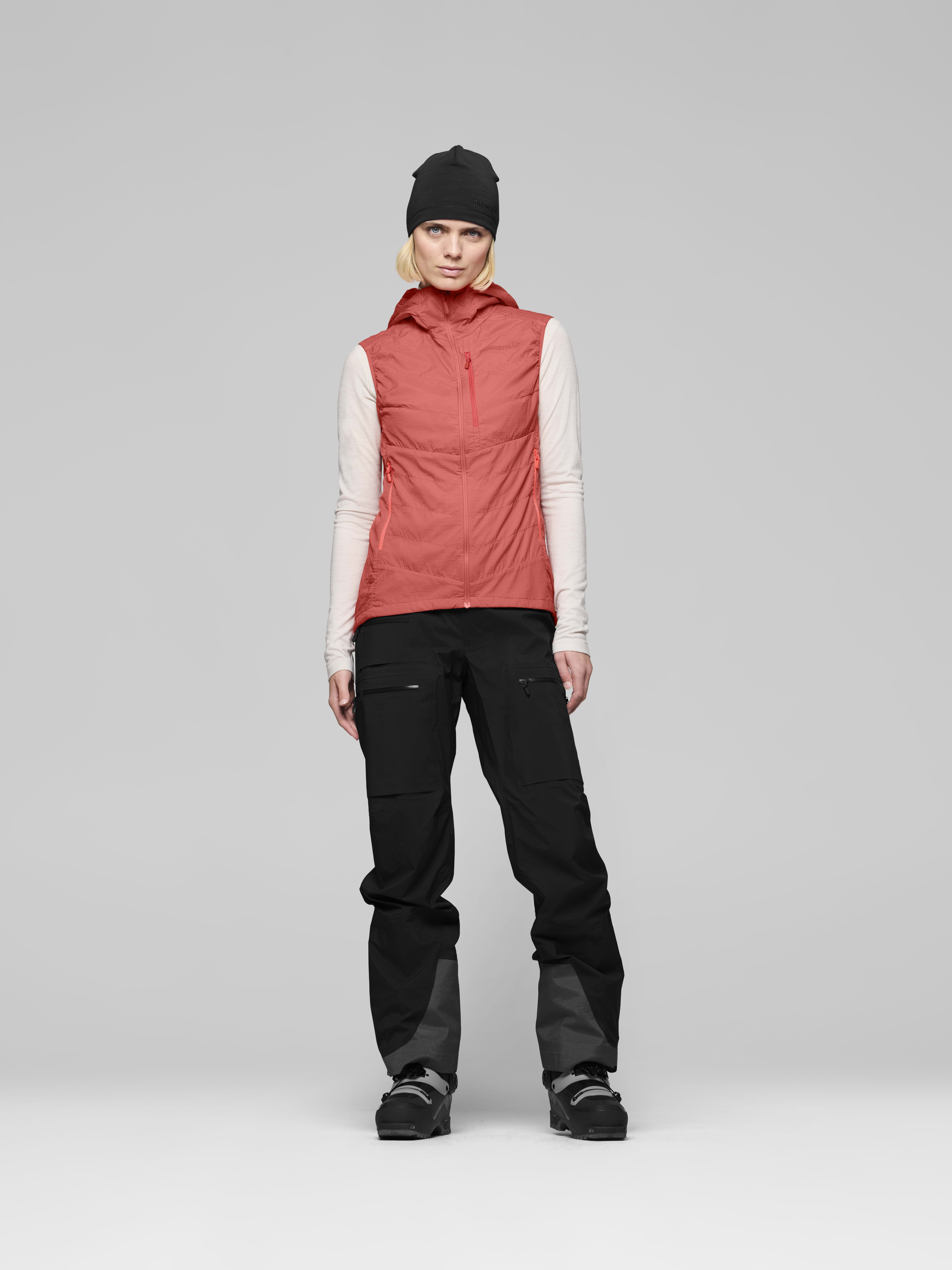 Female Look front image of lyngen thermo100active Vest Deep Sea Coral