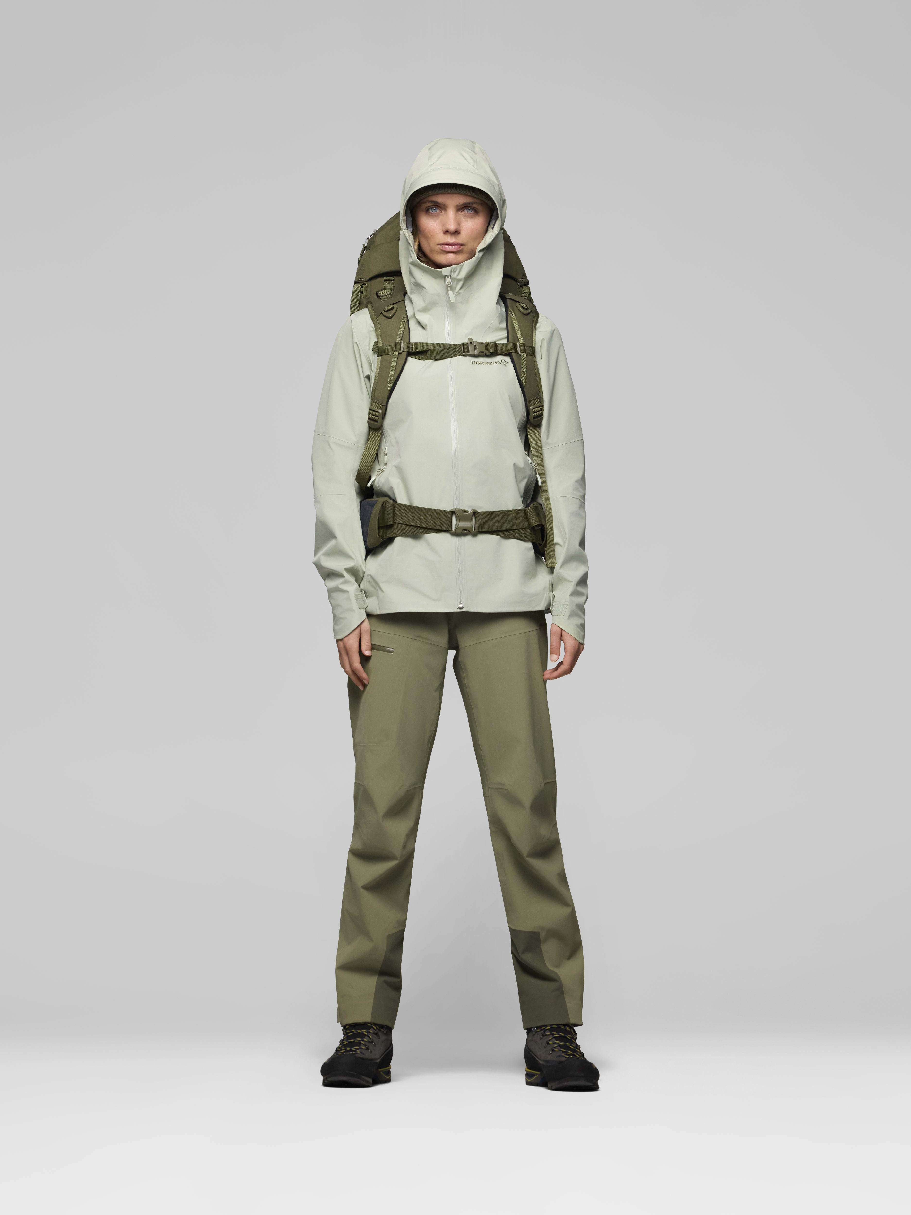 Female Look back image of femund synkron4 65L Pack Olive Night