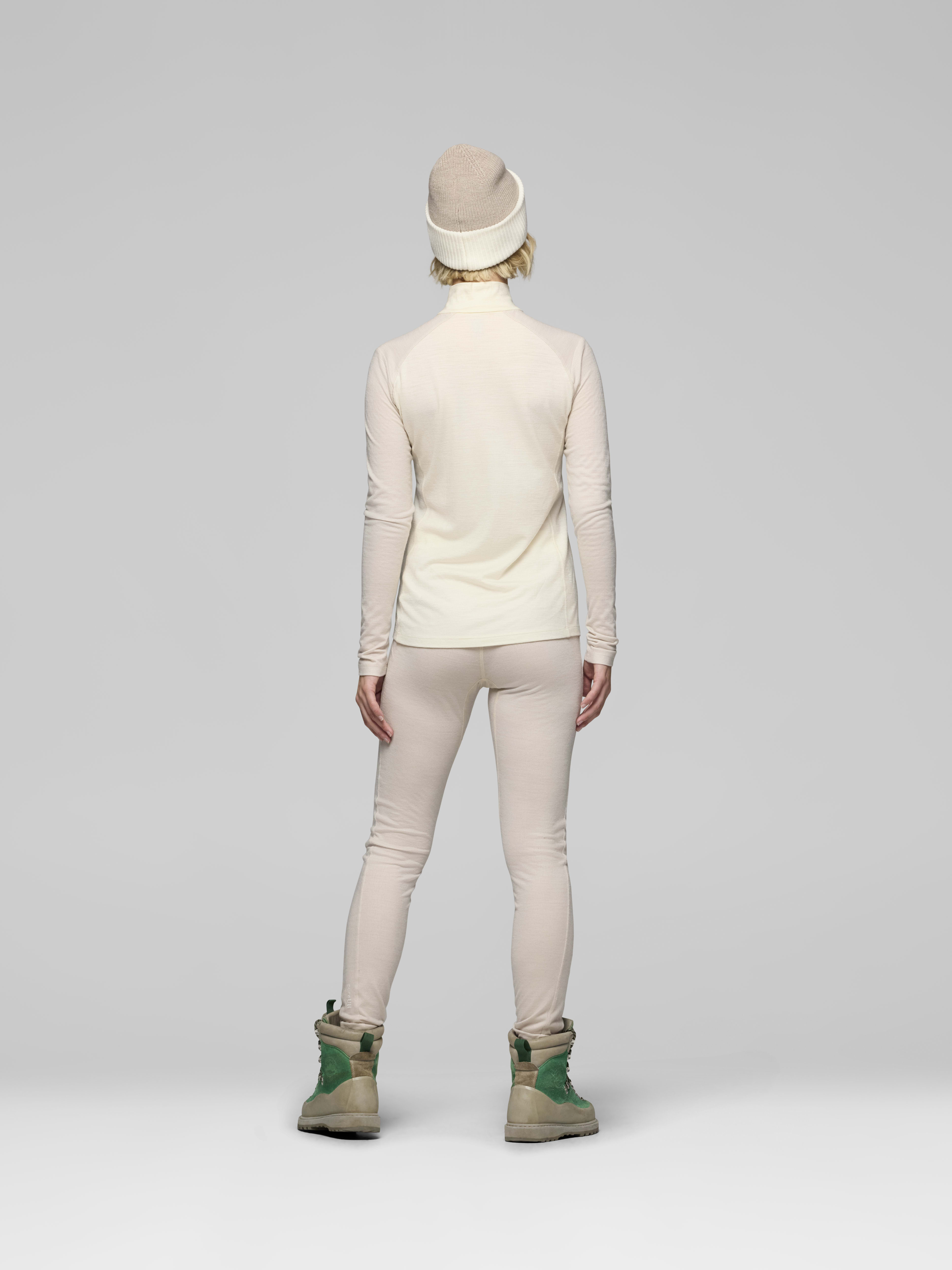 Female Look back image of femund pureUll Zip Neck Whisper White