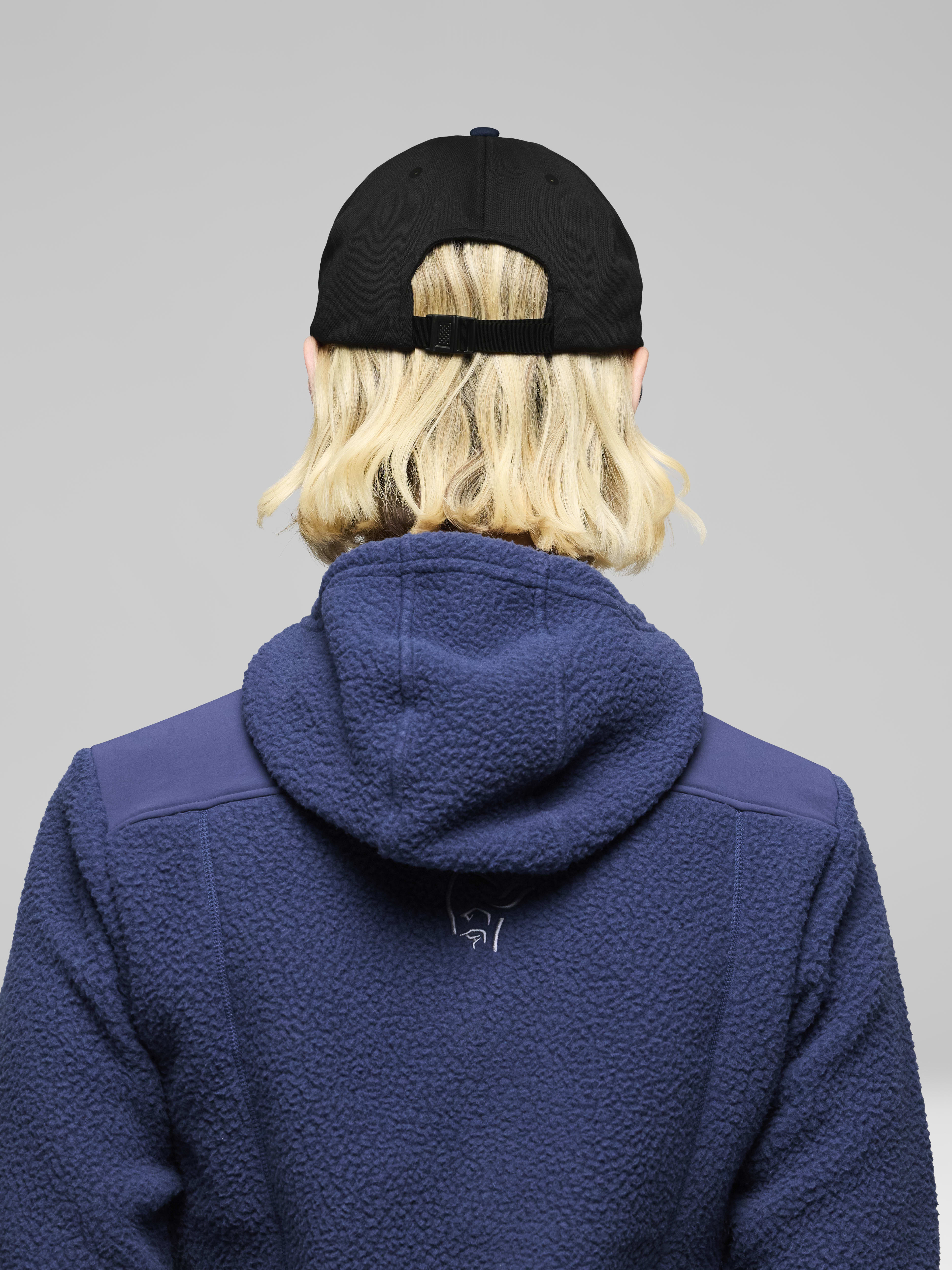 Female Look back image of 29 tech trucker Cap Indigo Night
