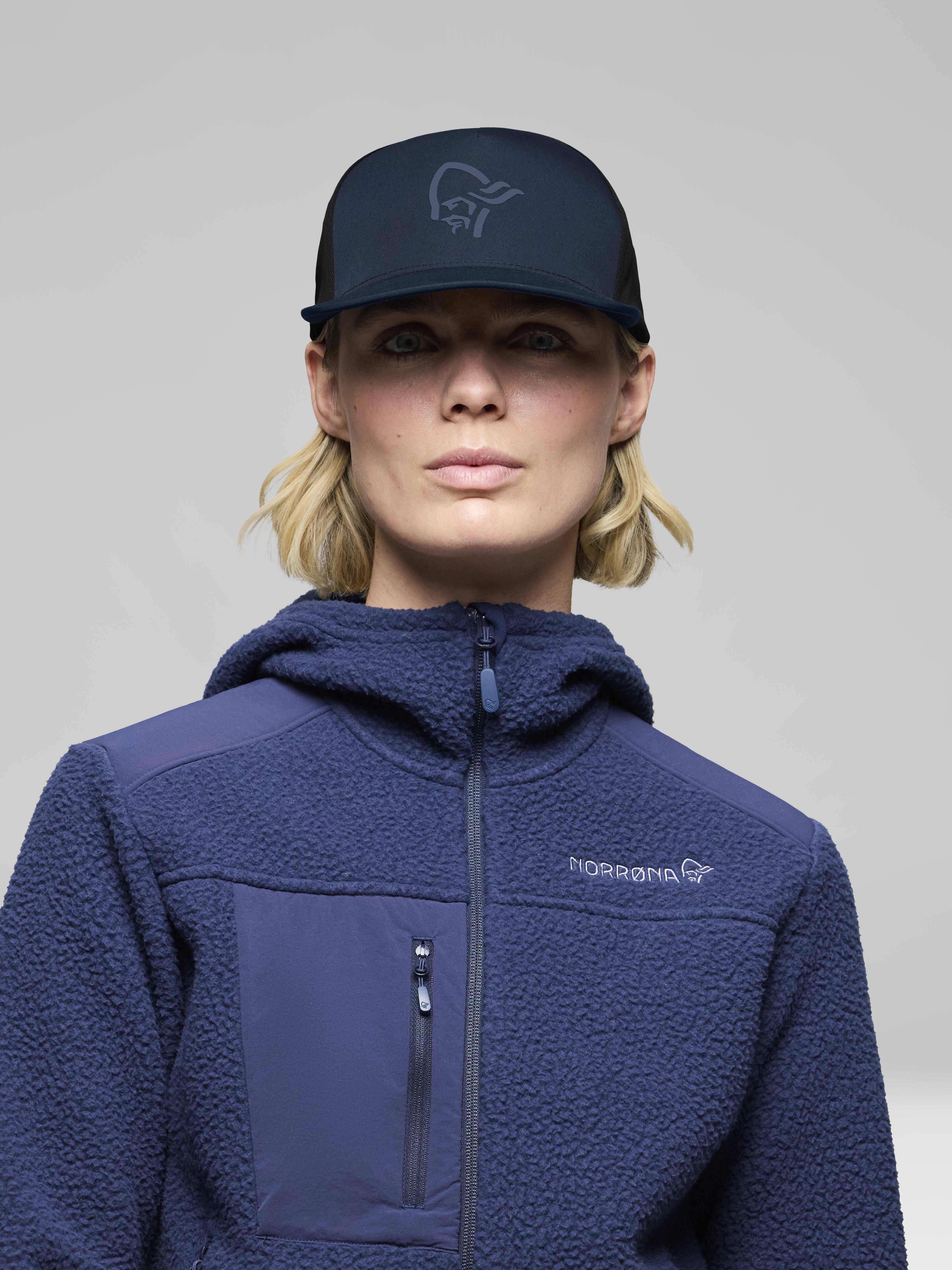 Female Look front image of 29 tech trucker Cap Indigo Night