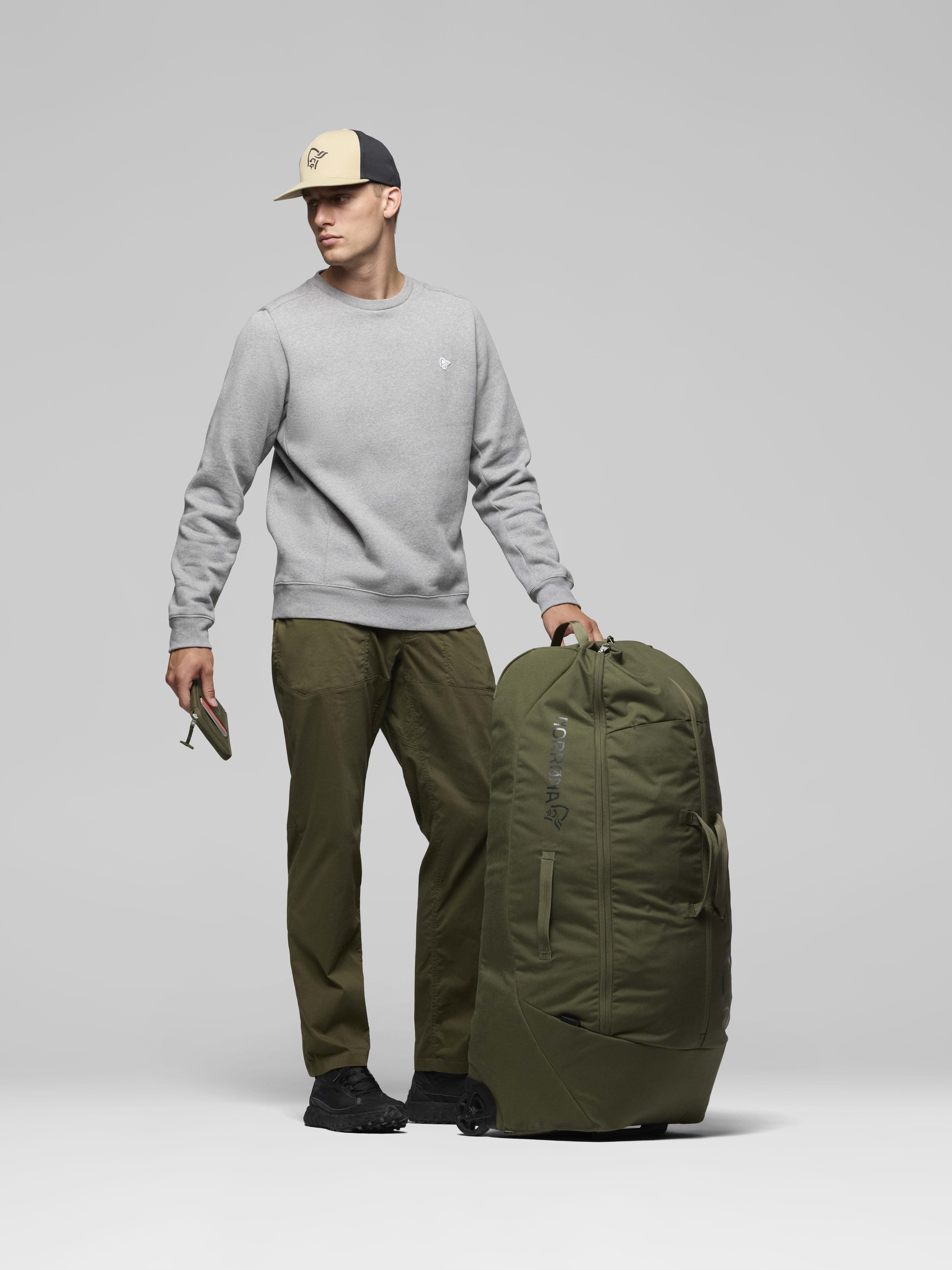 Female Look opening image of norrona 120L Trolley Bag Olive Night